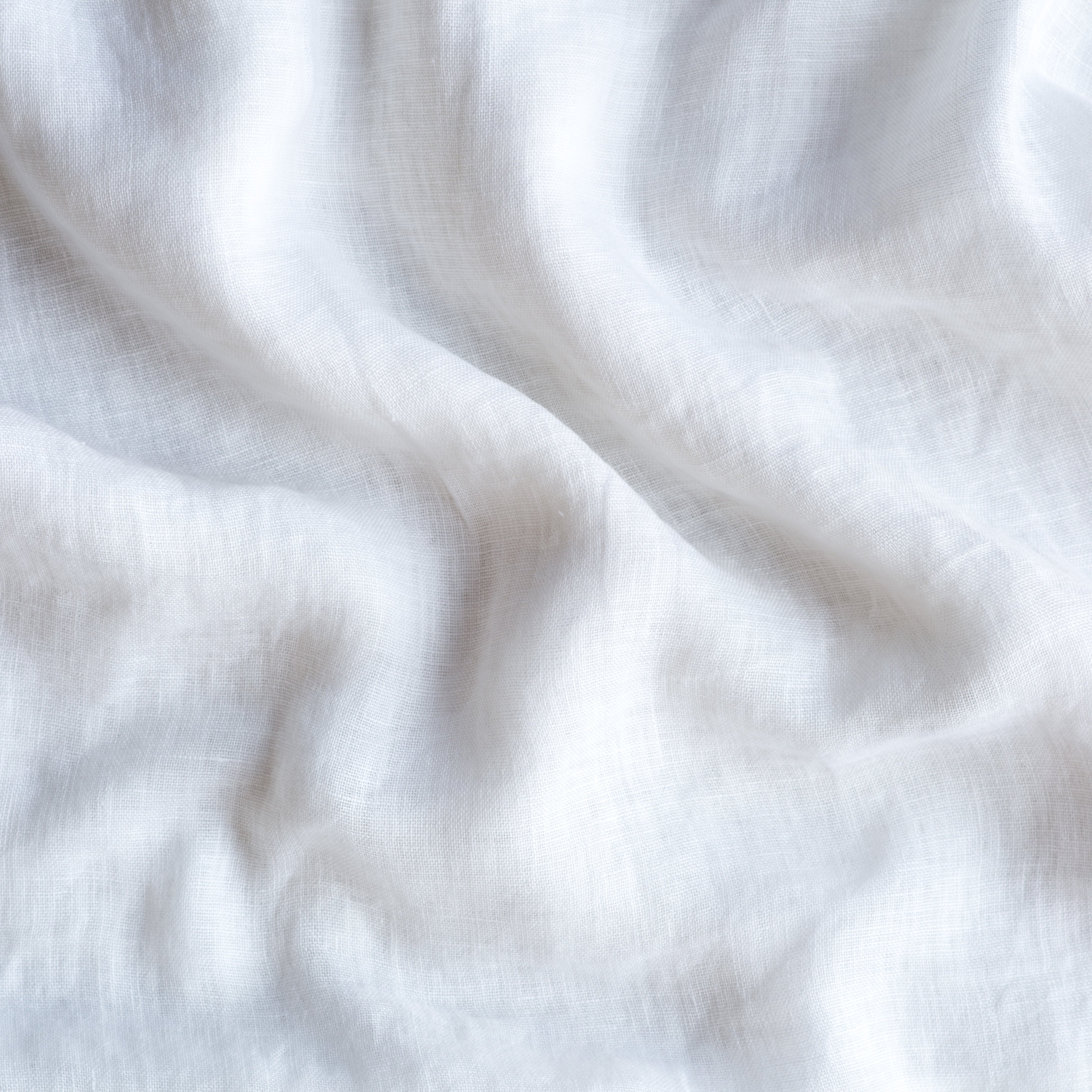 White: A close up of linen whisper, our lightweight linen gauze, in white.