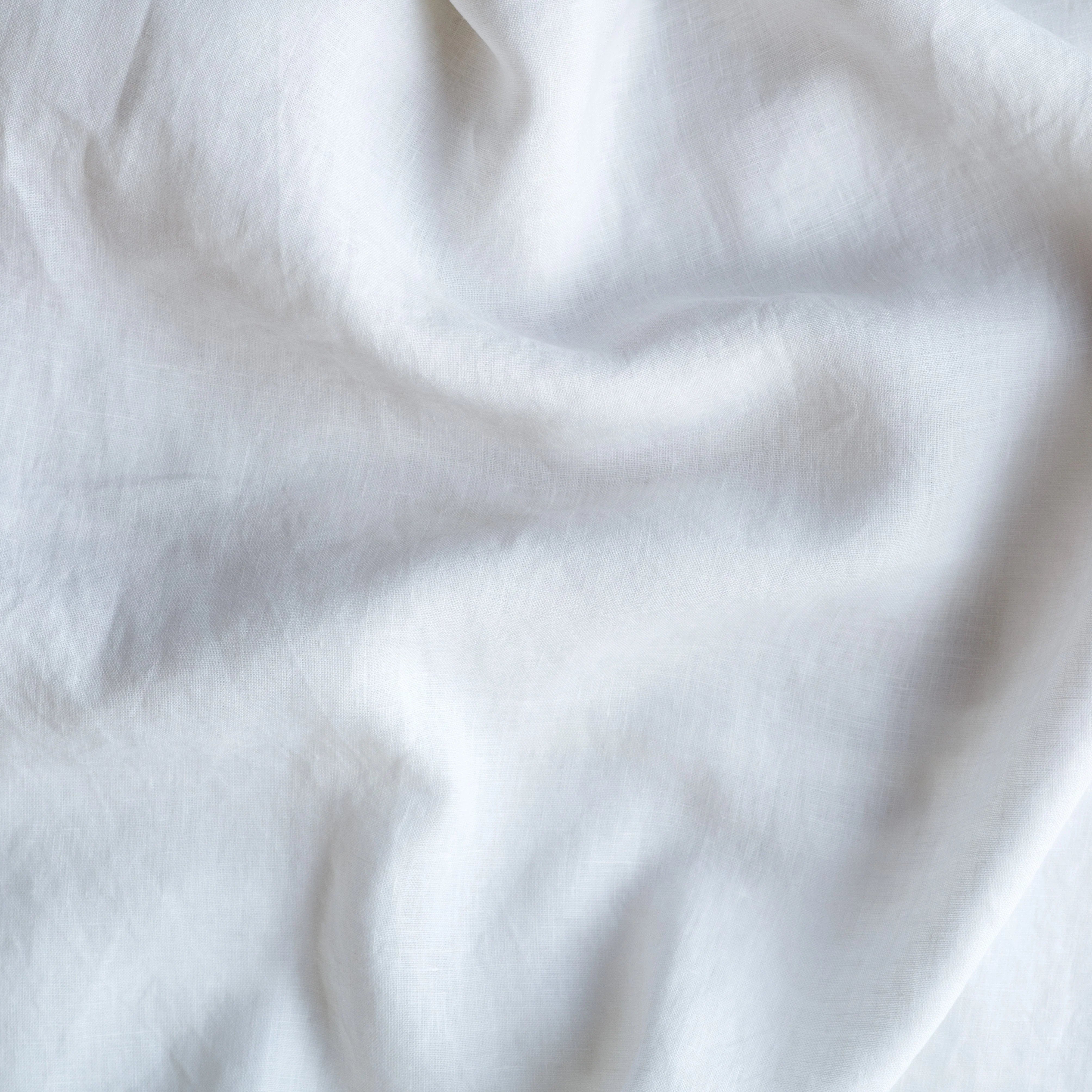 White: A close up of linen in white.
