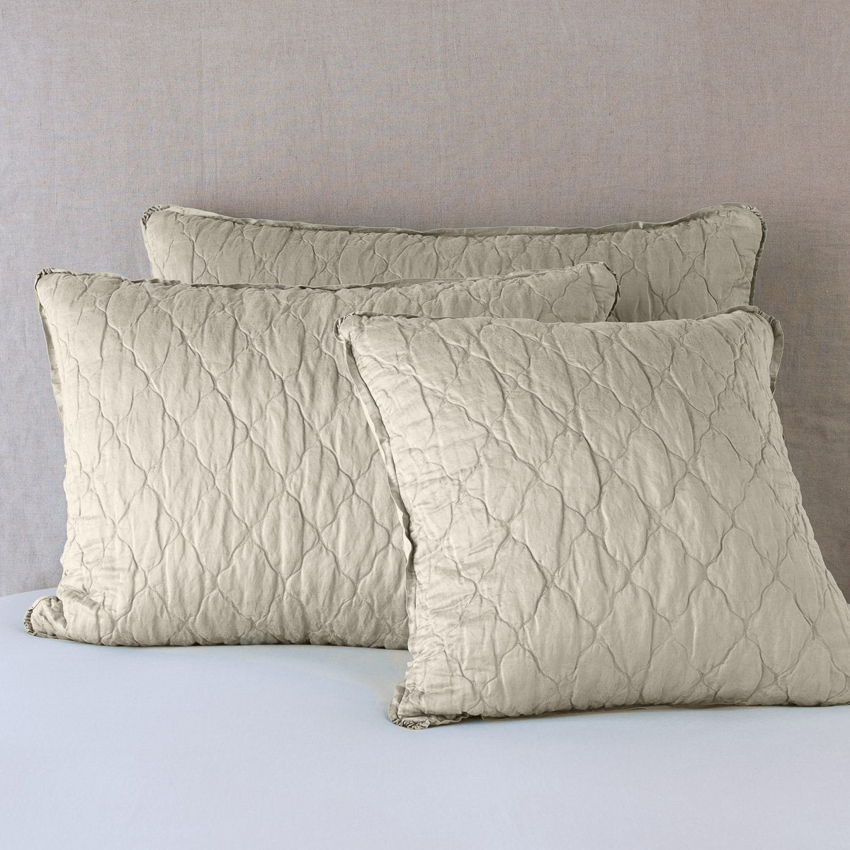 Fog: shams leaning upright against a neutral background.