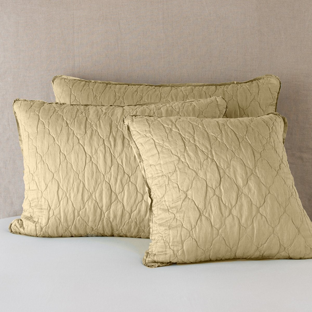 Honeycomb: shams leaning upright against a neutral background.