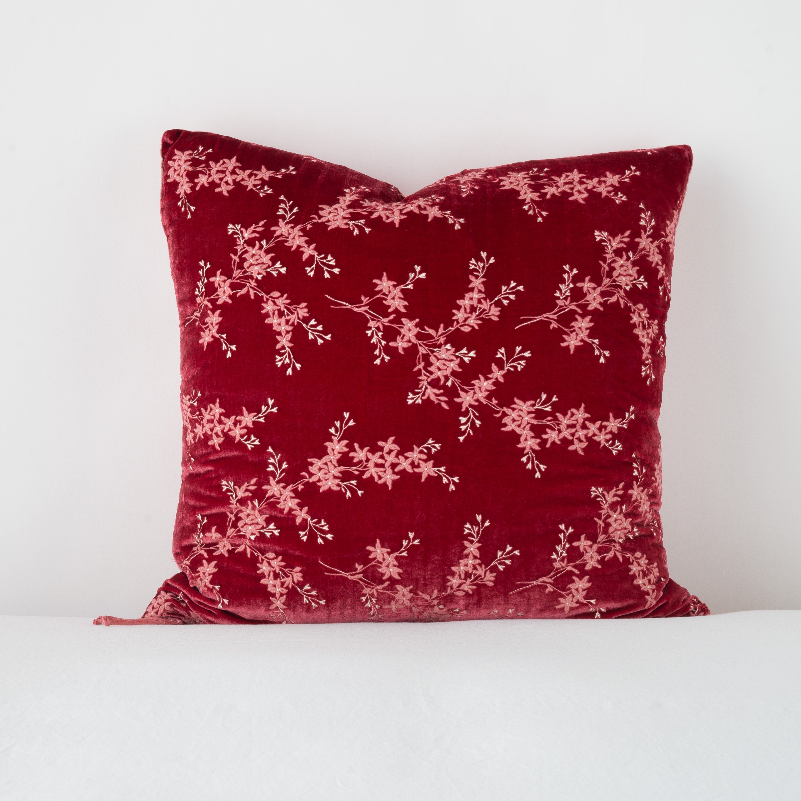 Poppy: pillow against a plain background - straight on view.