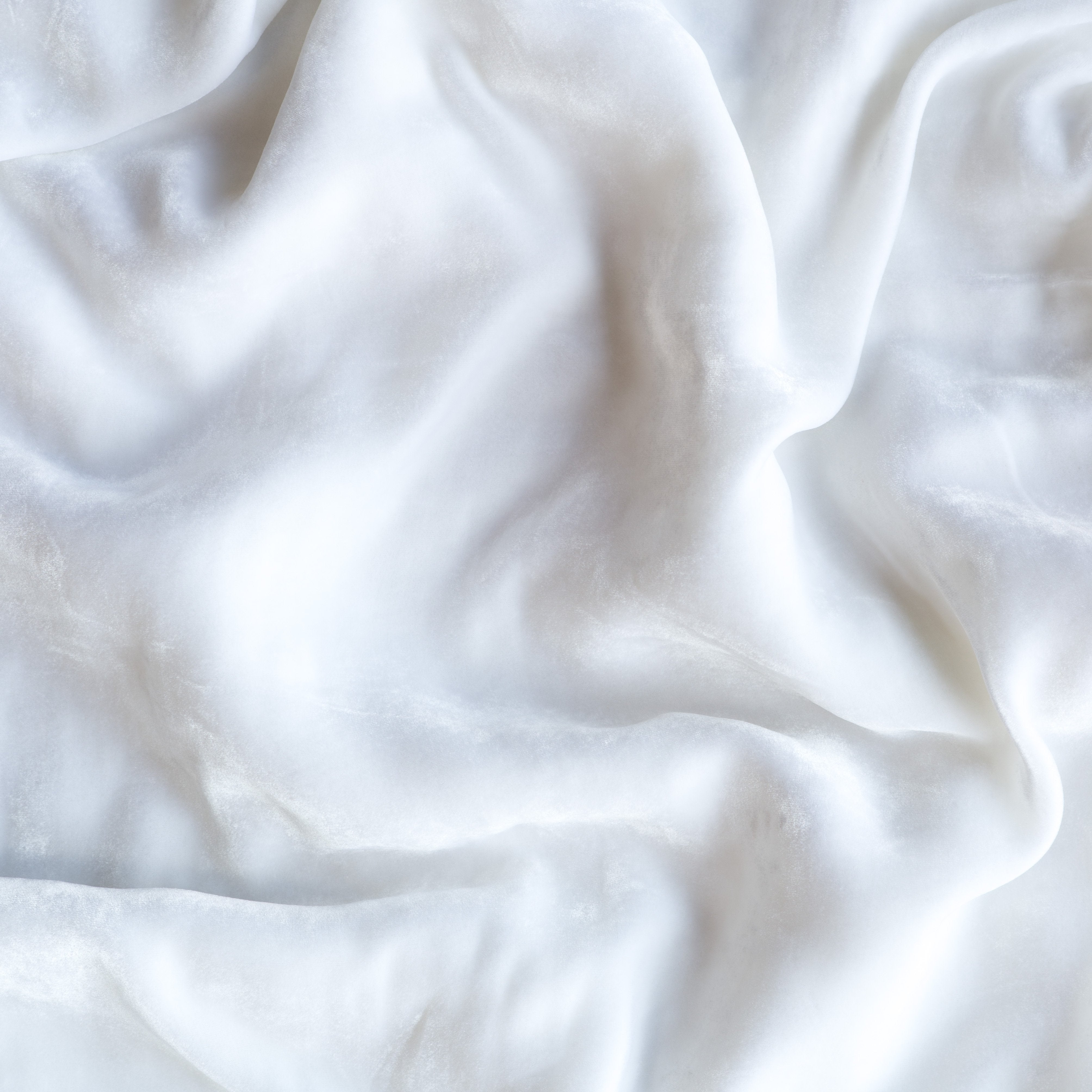 White: A close up of silk velvet in white.