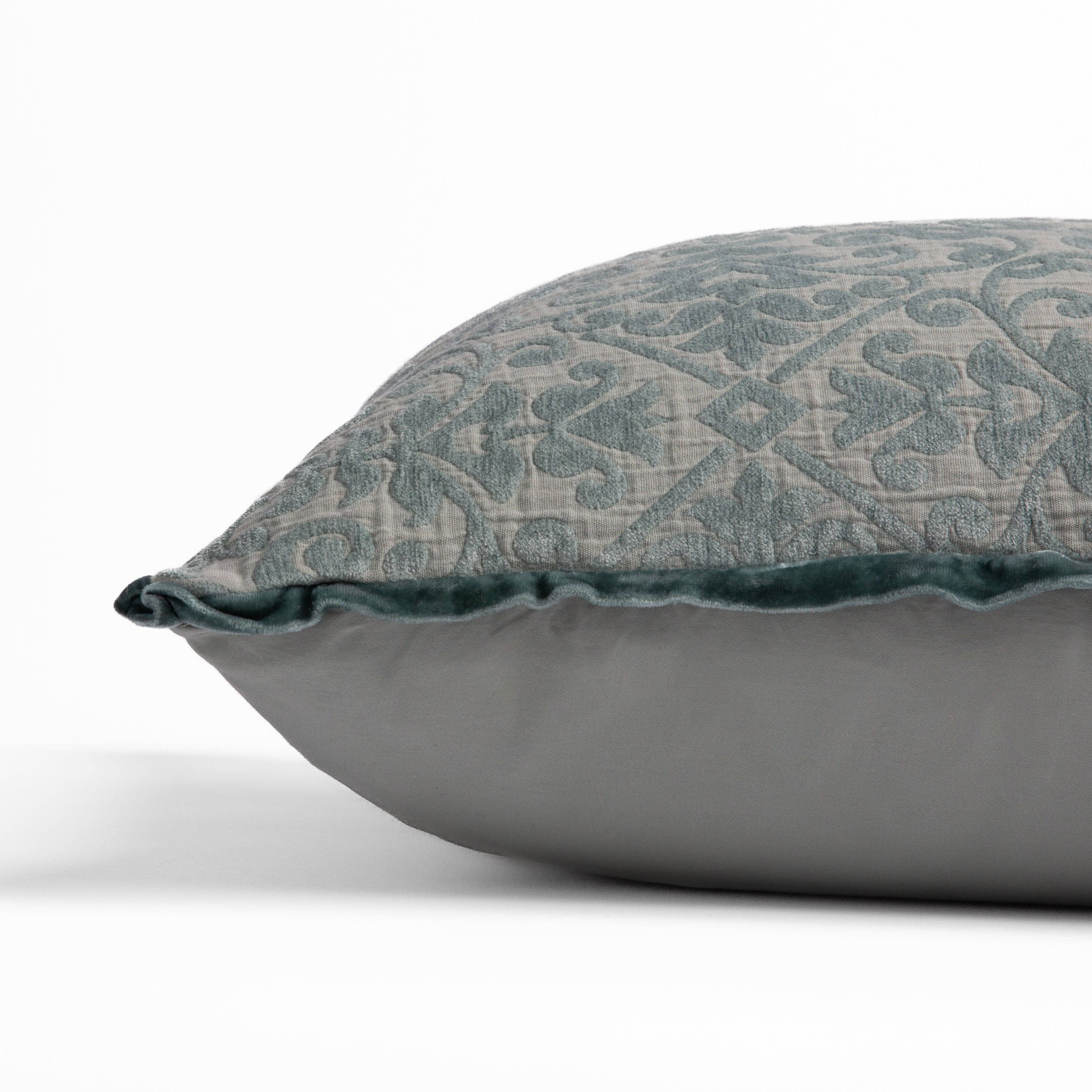 Eucalyptus: side view of 18x18 pillow shows cotton sateen back and silk velvet trim detail β close up against a white background.