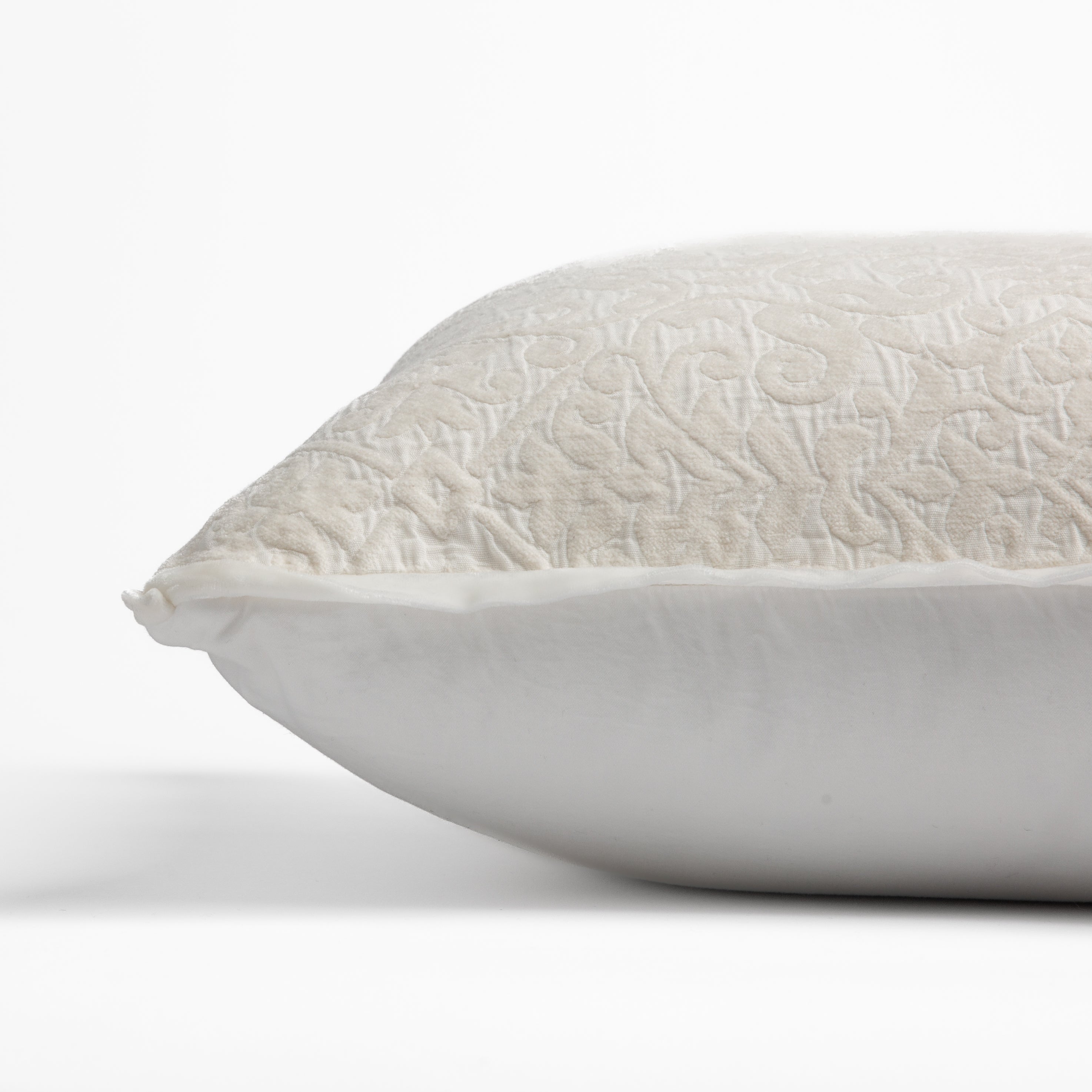 Winter White: side view of 18x18 pillow shows cotton sateen back and silk velvet trim detail β close up against a white background.