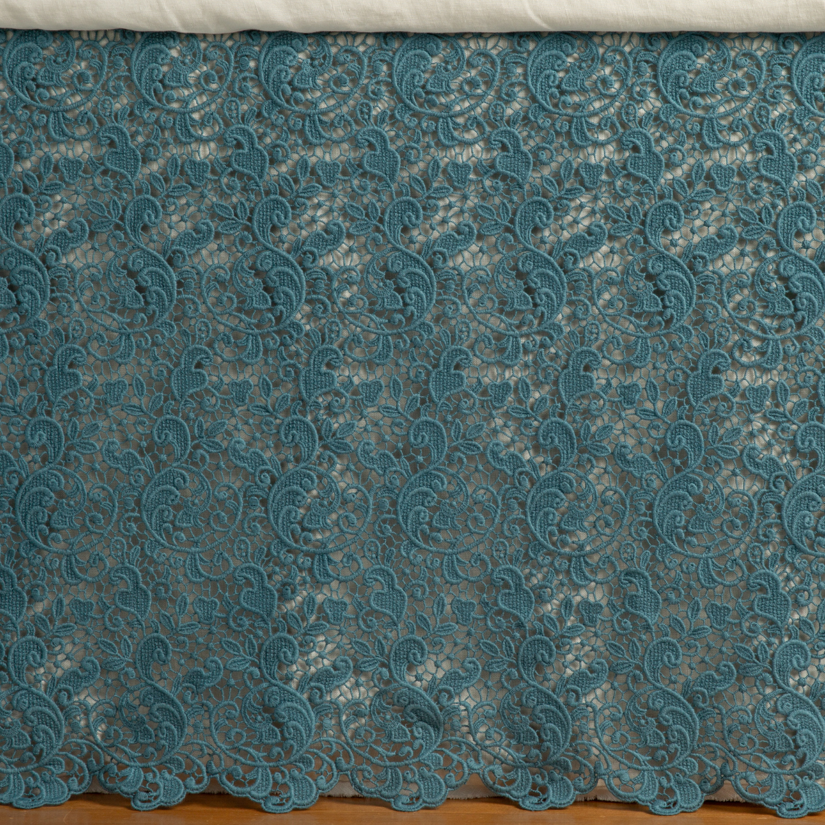 Cenote: a close up of a cotton lace bed skirt layered over a winter white bed skirt - shot straight at the bed skirt. 