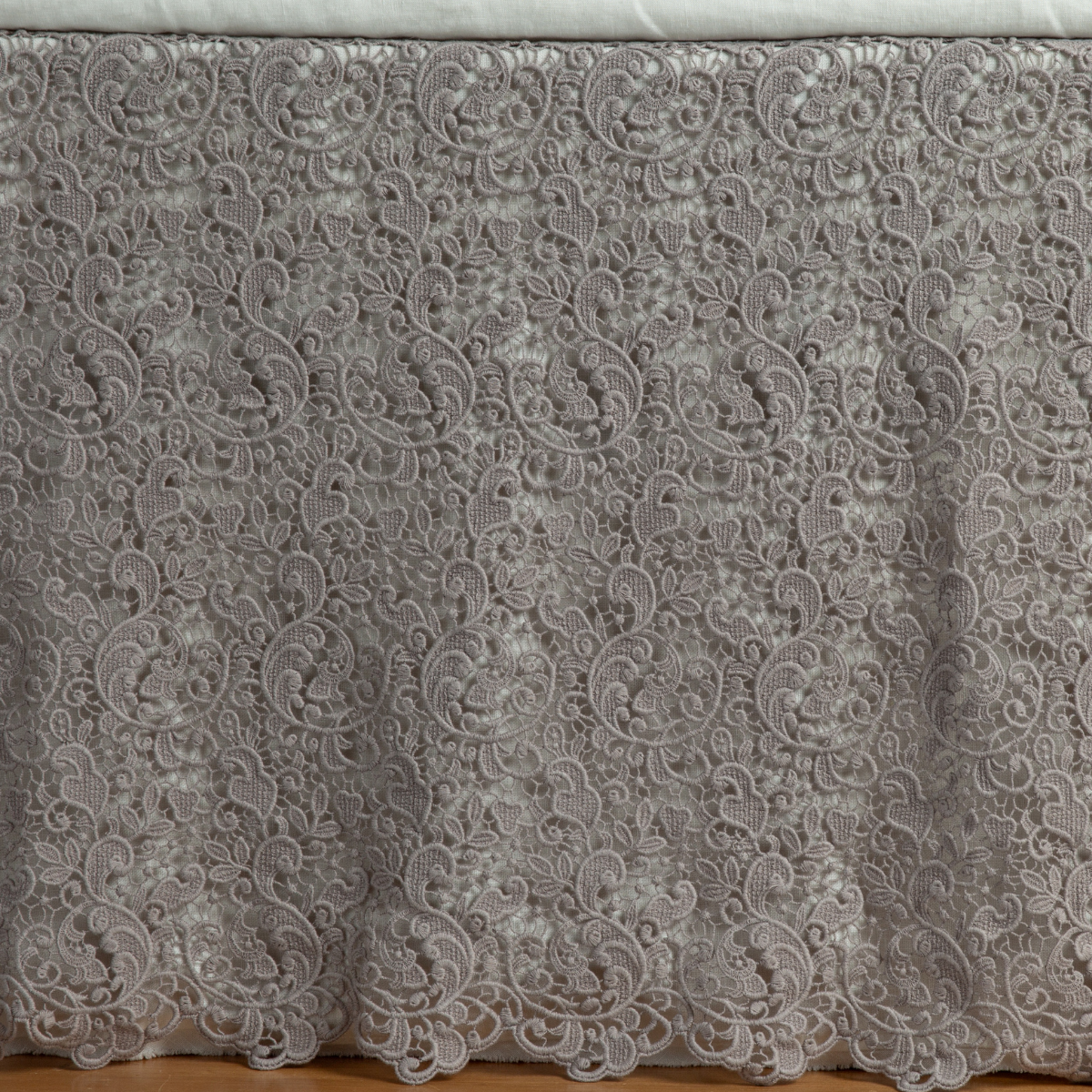 Moonlight: a close up of a cotton lace bed skirt layered over a winter white bed skirt - shot straight at the bed skirt. 