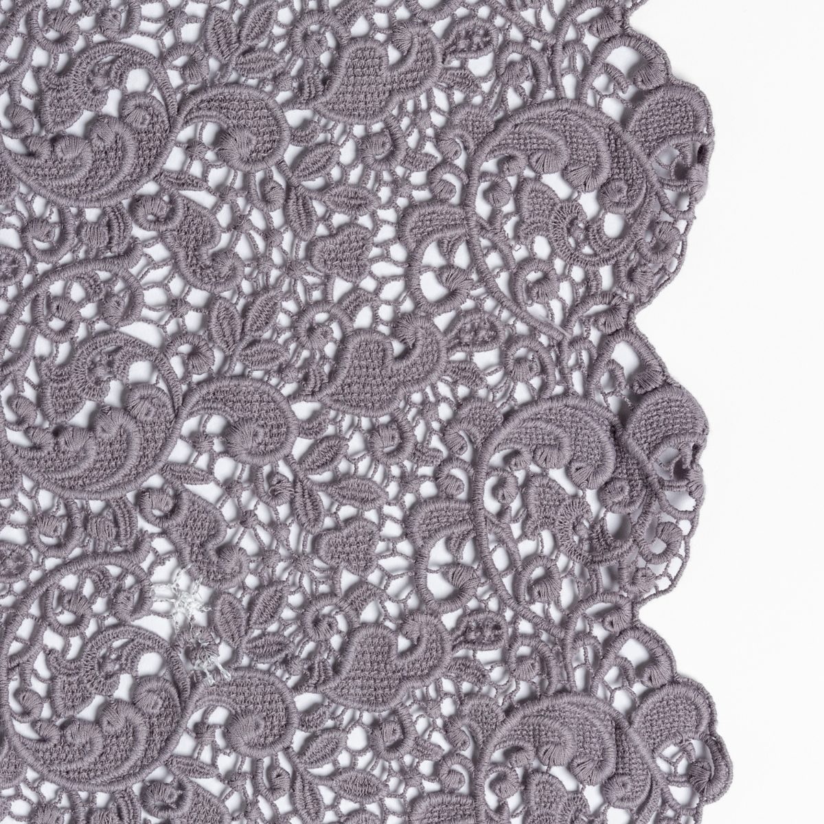 French Lavender: a close up of cotton all-over lace with a scalloped edge.