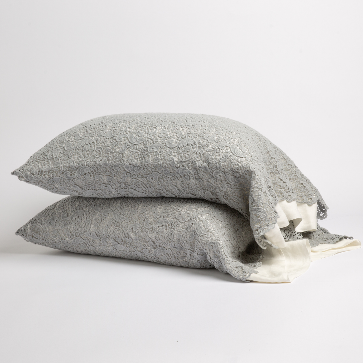 Mineral: a pair of stacked cotton lace pillowcase covers on winter white liners against a white background. 