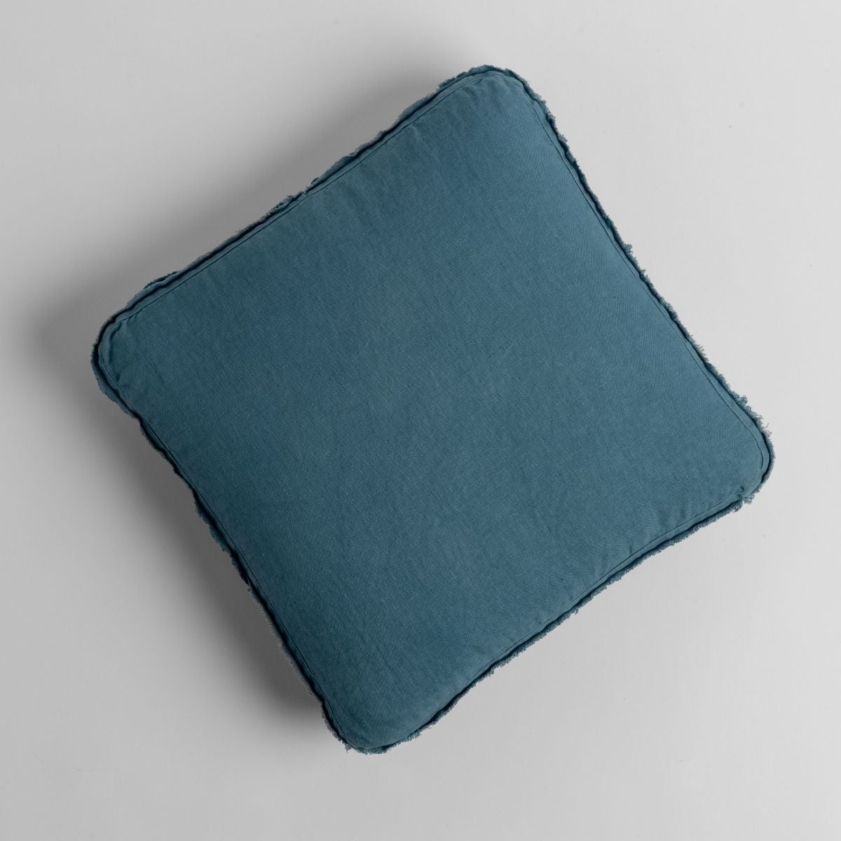 Cenote: midweight linen 18x18 inch throw pillow shot from overhead against a white background. 