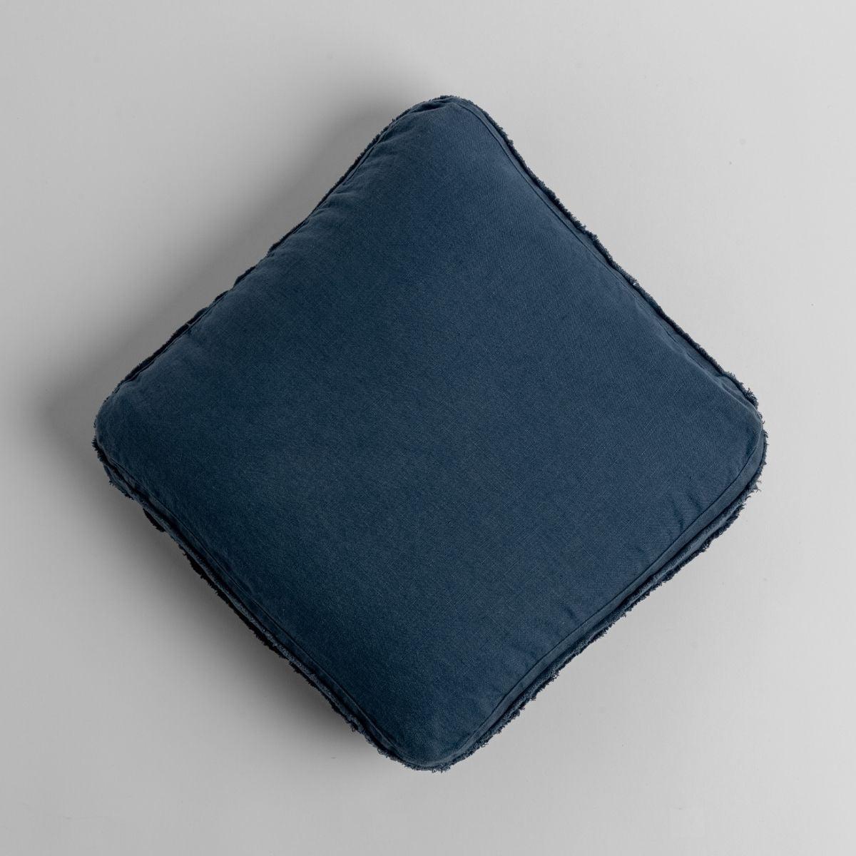 Midnight: midweight linen 18x18 inch throw pillow shot from overhead against a white background. '