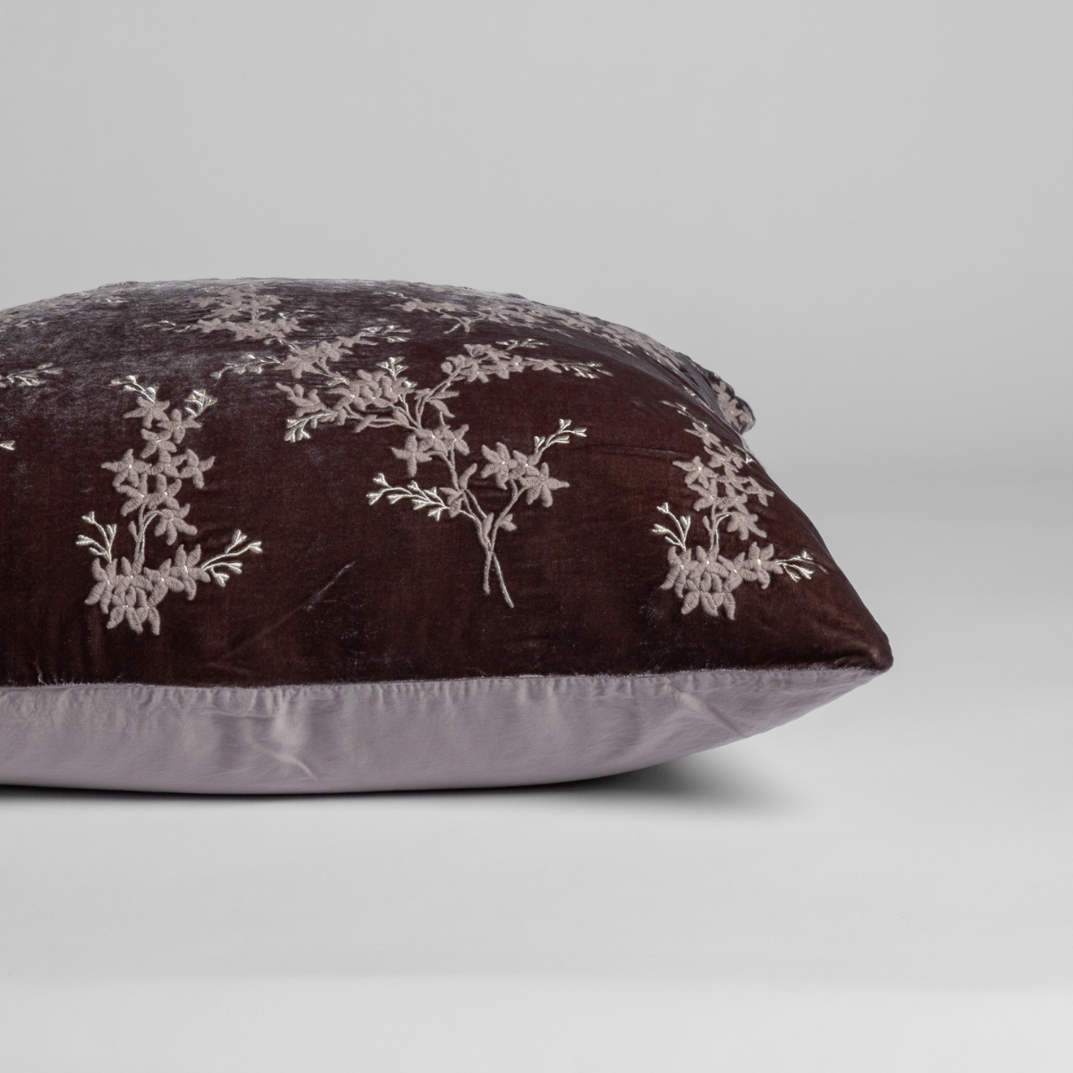 Fog: A close-up of the sham shown on its side to display the embroidered silk velvet face and tencel back — shown against a white background. 