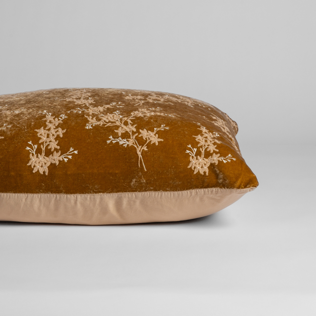 Honeycomb: A close-up of the sham shown on its side to display the embroidered silk velvet face and tencel back — shown against a white background. 