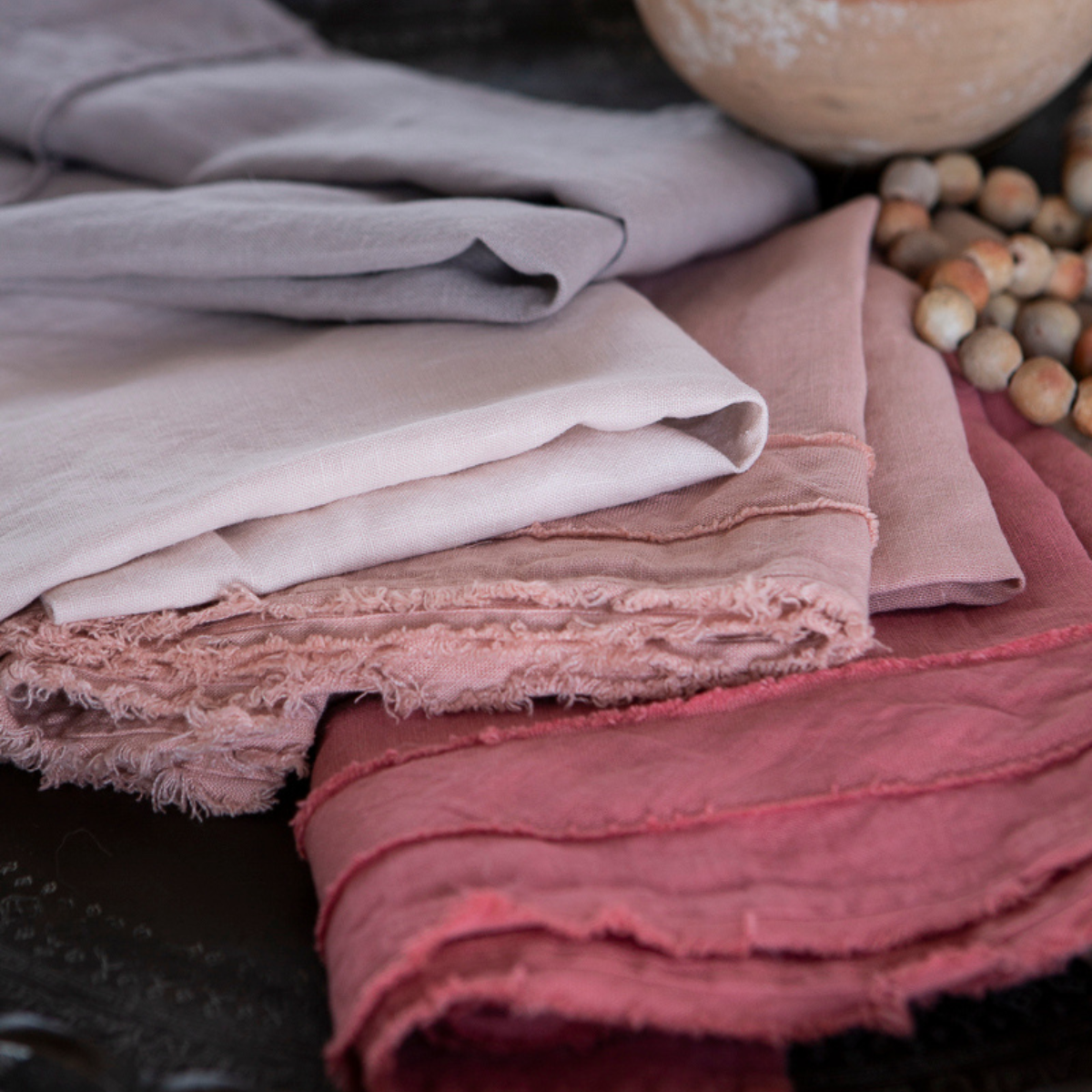 : a close up of the raw trim details on  midweight linen guest towels. 