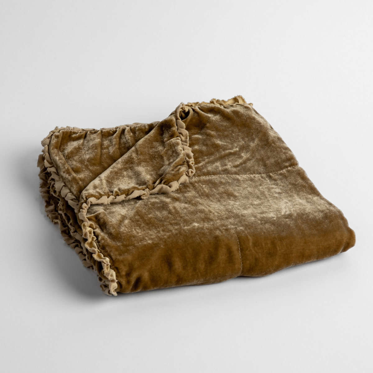 Honeycomb:  silk velvet baby blanket with charmeuse trim shown slightly overhead with a corner folded back to show trim detail against a white background. 