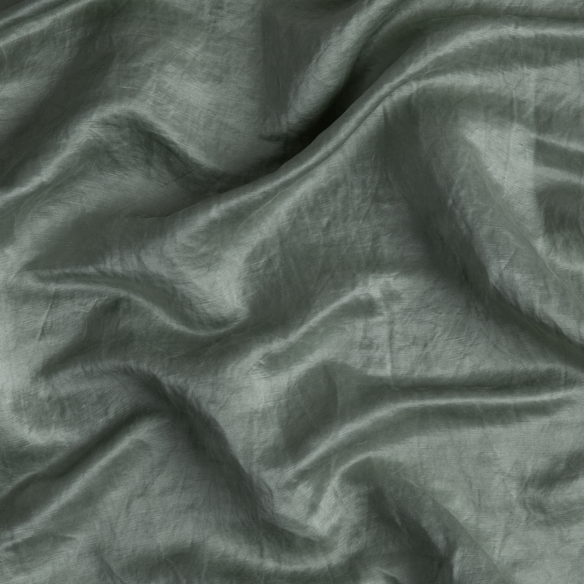 Eucalyptus: A close up of charmeuse fabric in eucalyptus, a soft light green.