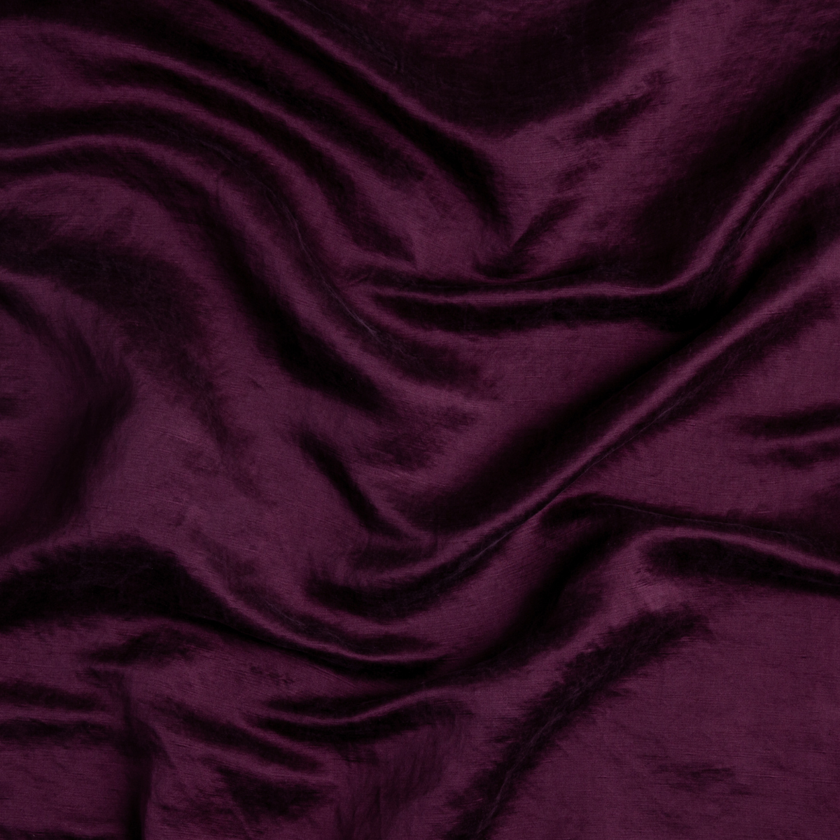 Fig: A close up of charmeuse fabric in fig, a richly saturated purple-garnet.