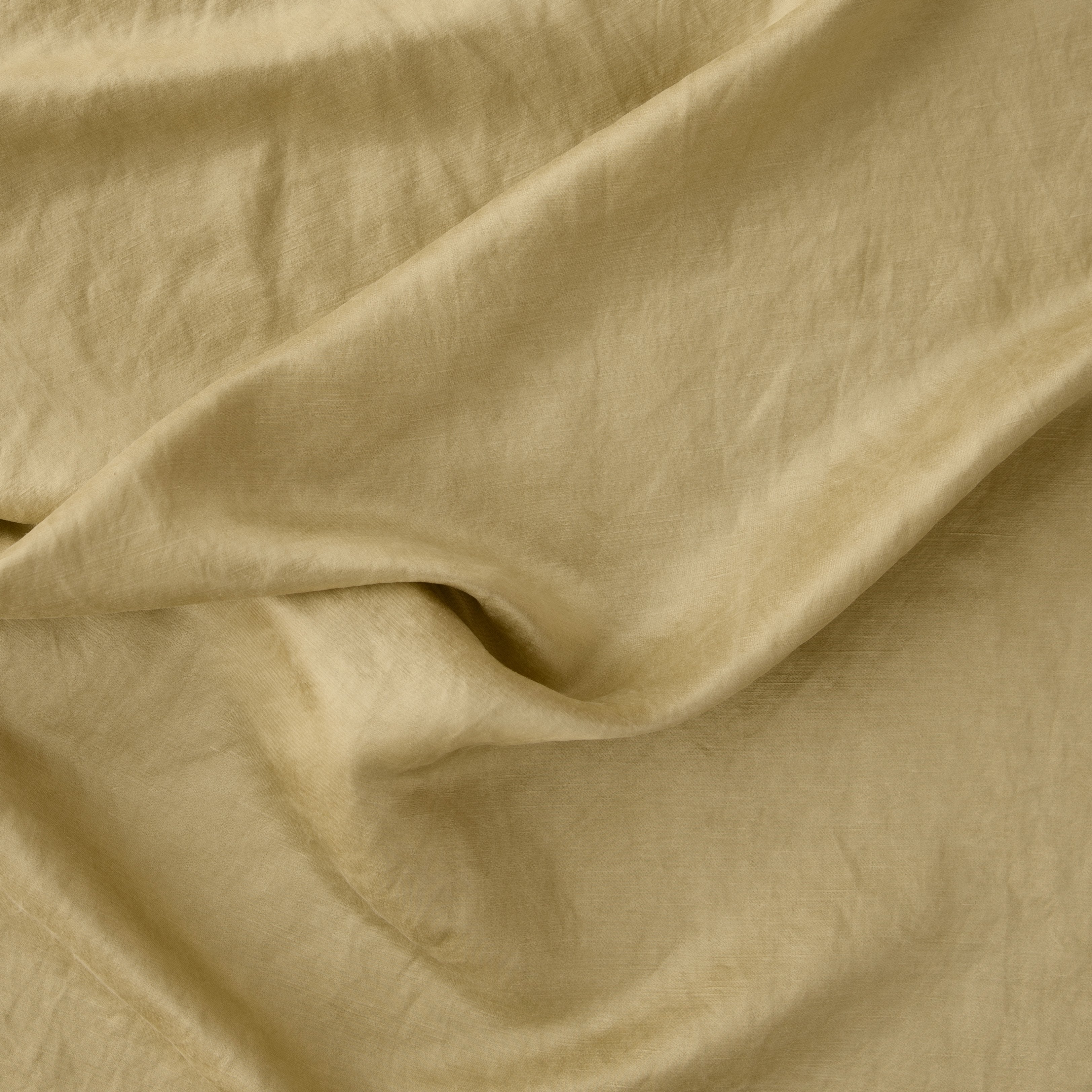 Honeycomb: Close-up of silk charmeuse in honeycomb, a warm golden tone.