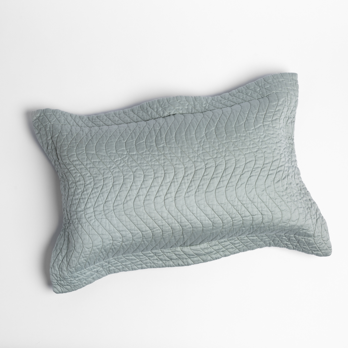 Eucalyptus: 15x24 quilted cotton sateen throw pillow shot overhead against a white background. 