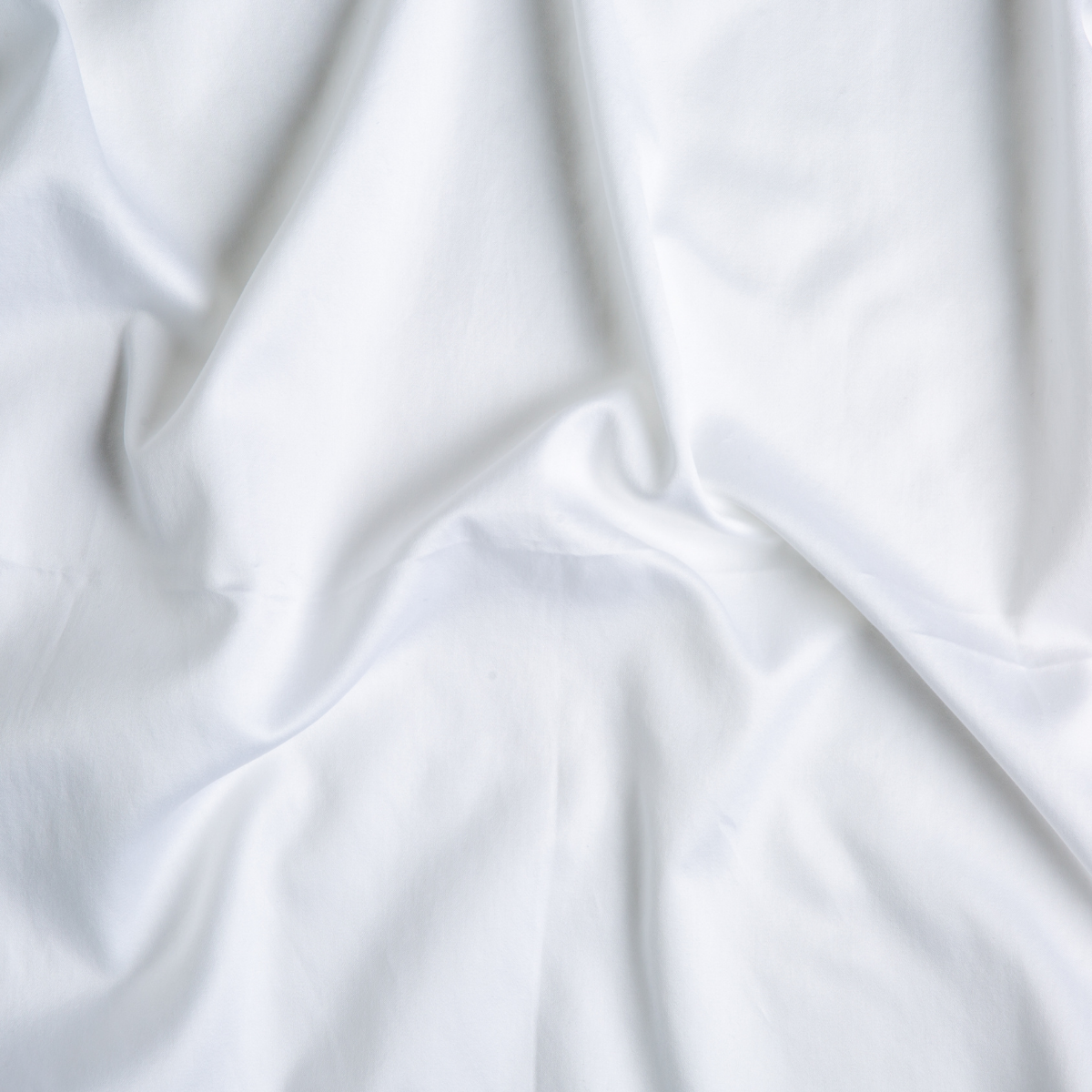 White: A close up of cotton sateen fabric in classic white.