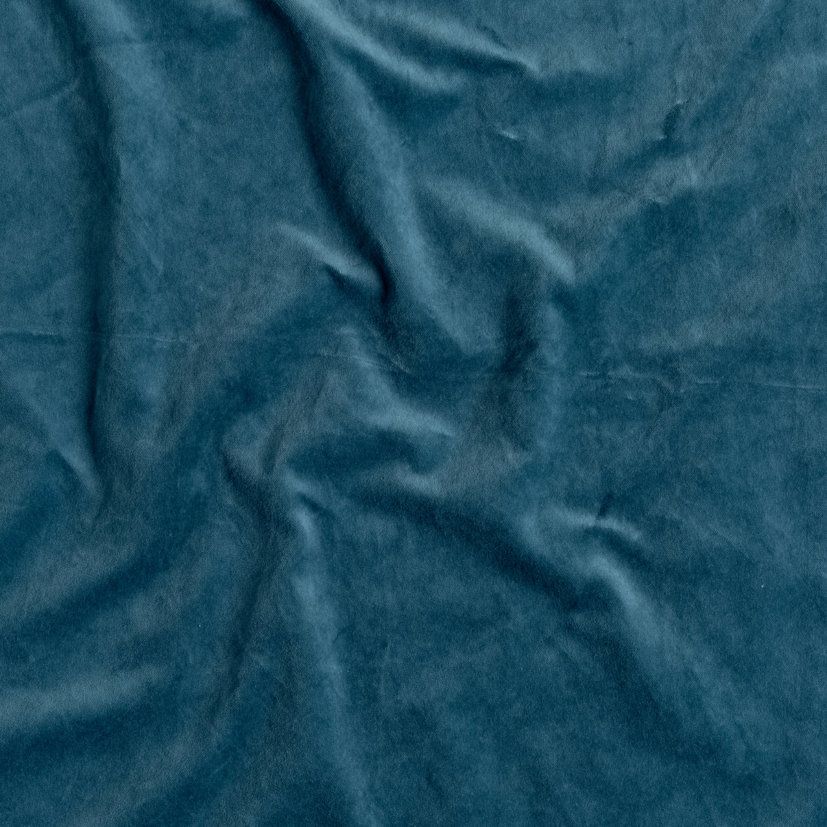 Cenote: A close up of cotton velvet fabric in cenote, a vibrant, ocean-inspired blue-green.