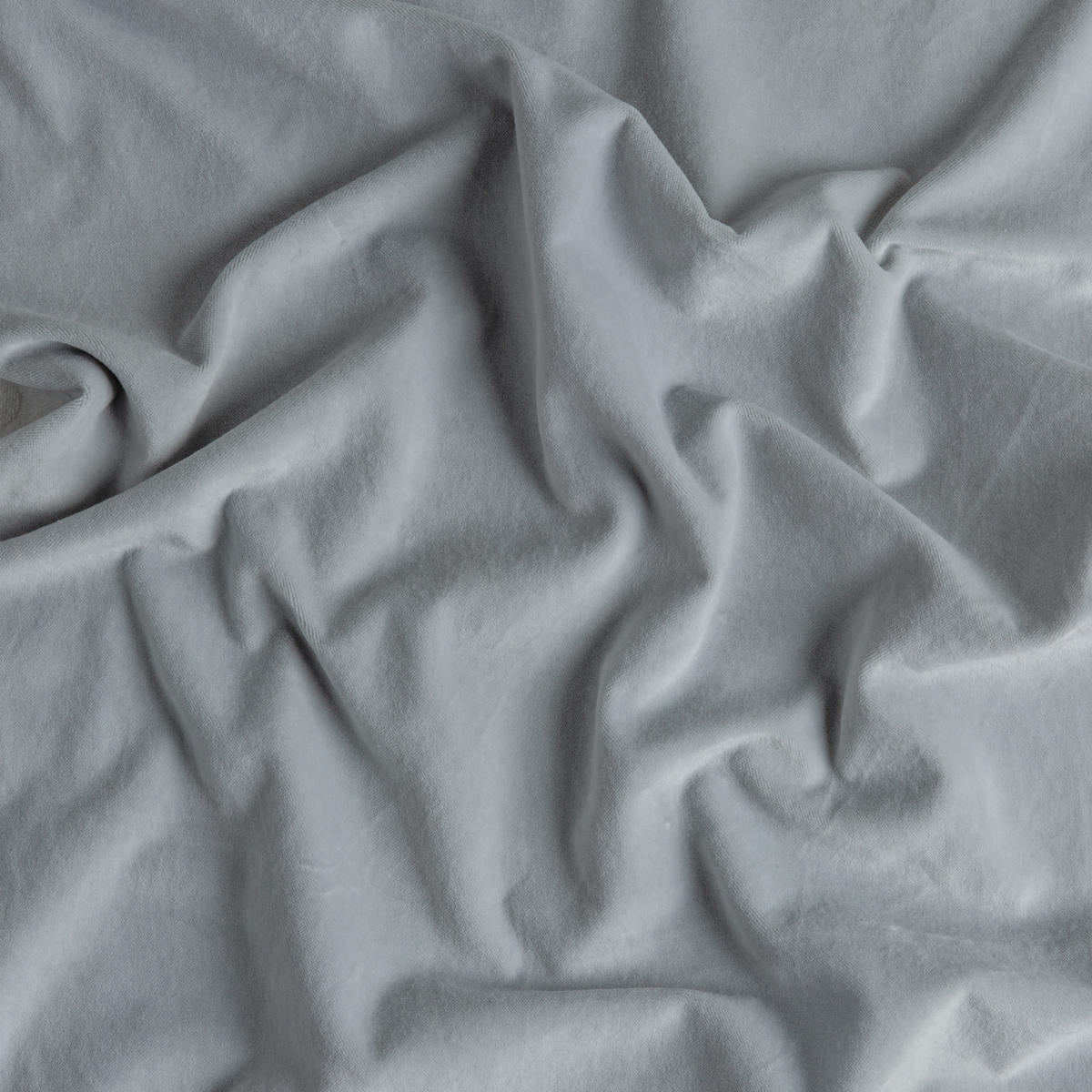 Cloud: A close up of cotton velvet fabric in cloud, a soft, subtle sky blue-grey.