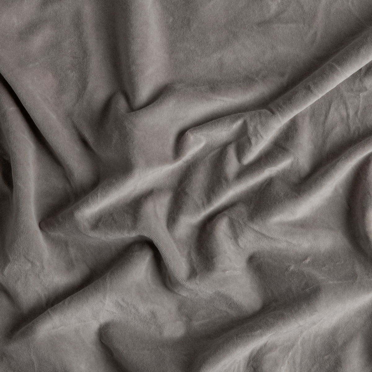 Fog: A close up of cotton velvet fabric in fog, a neutral-warm, soft mid-tone grey.