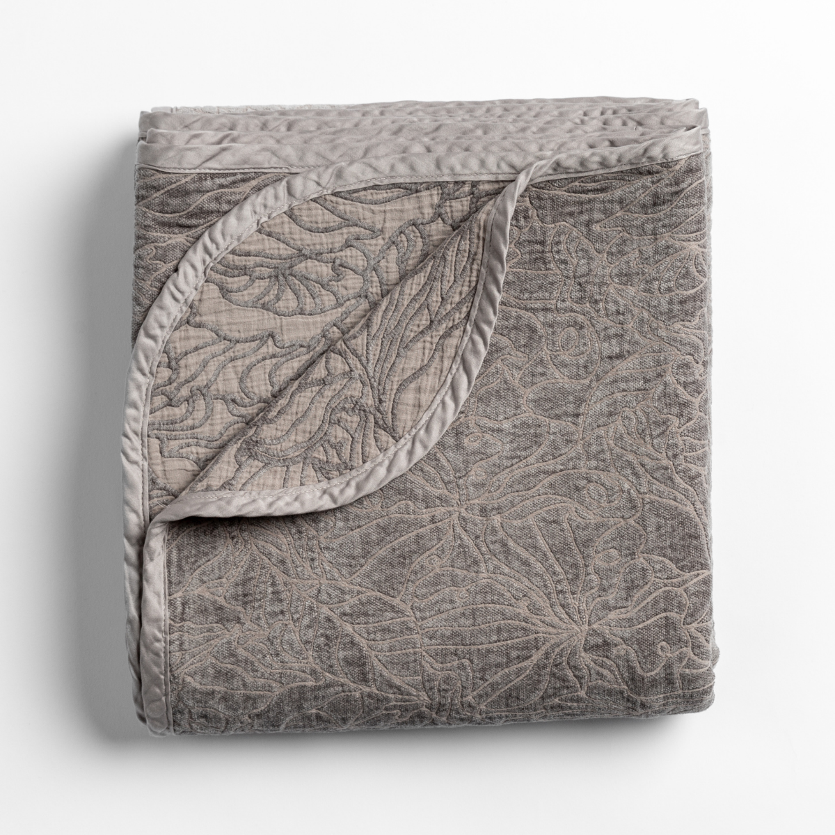 Moonlight: folded blanket with its cotton jacquard side visible on the corner foldback against the chenille jacquard side. 