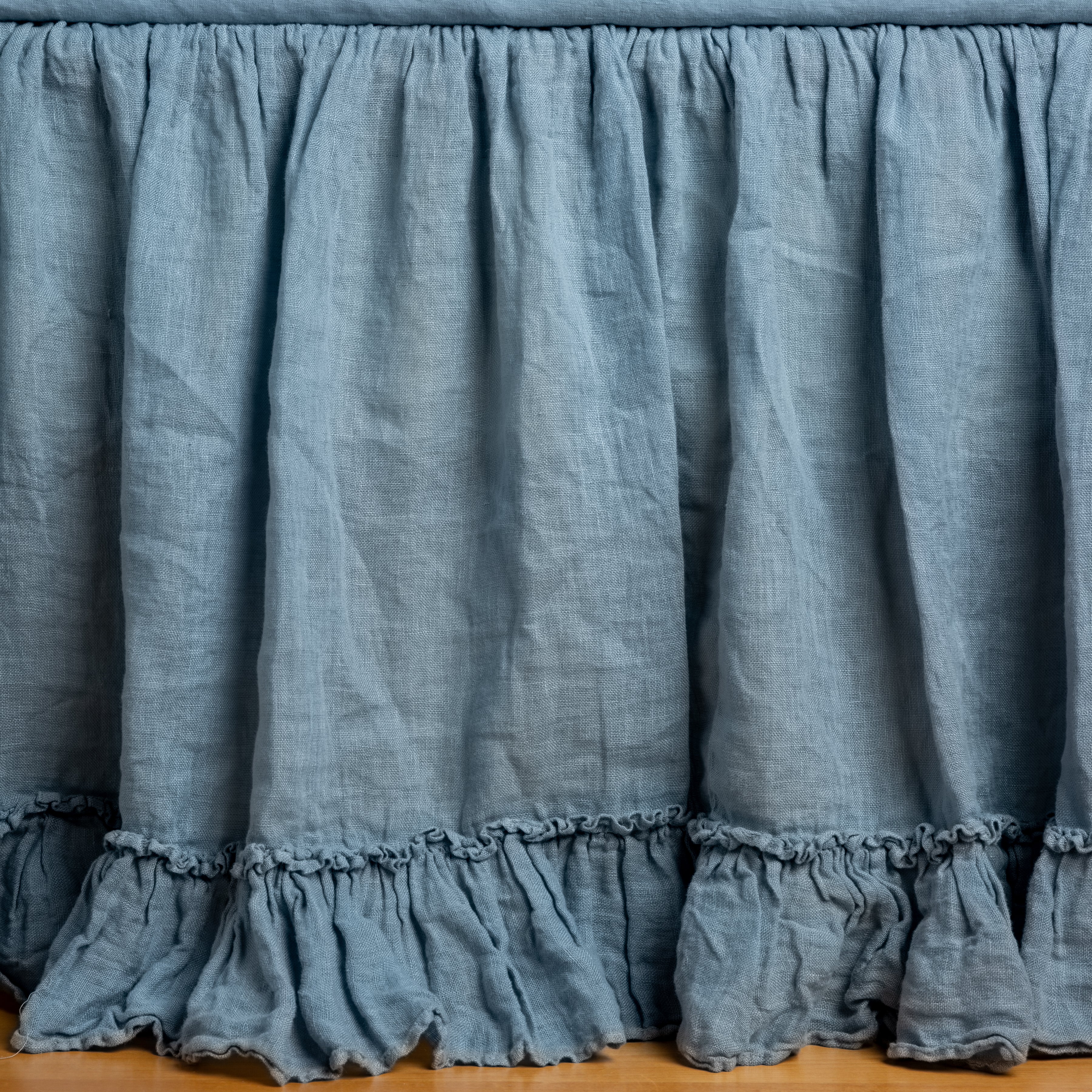 Tahoe Blue: Close up of bed skirt, showcasing ruffle detail - side view.