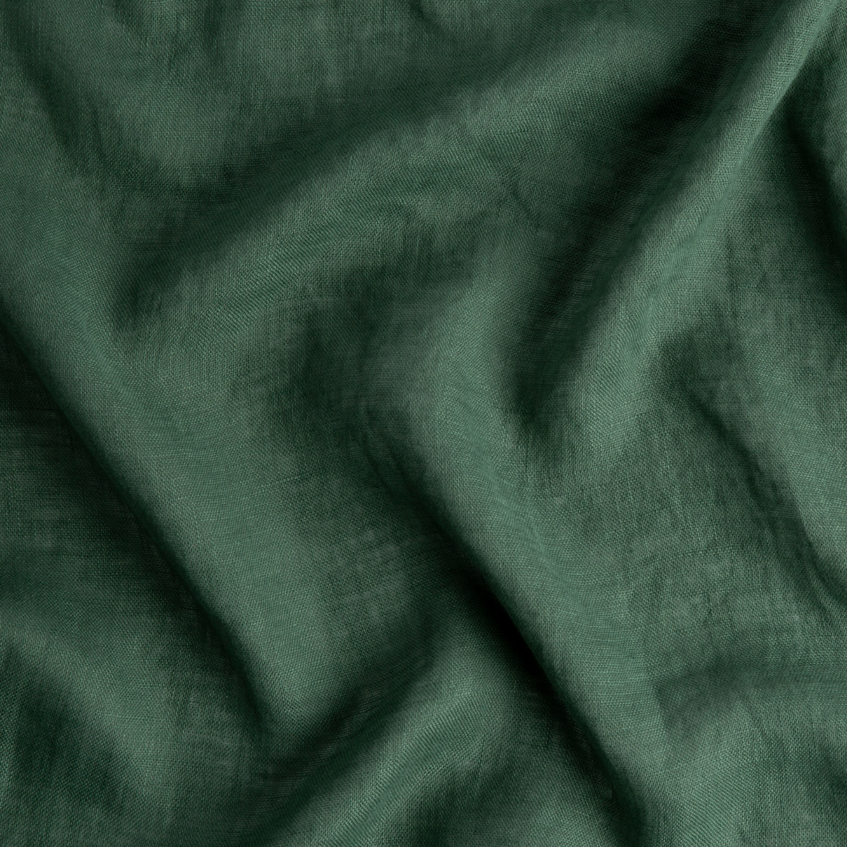 Jade: A close up of linen whisper, our lightweight linen gauze, in jade, a rich, verdant green with subtle blue undertones. 