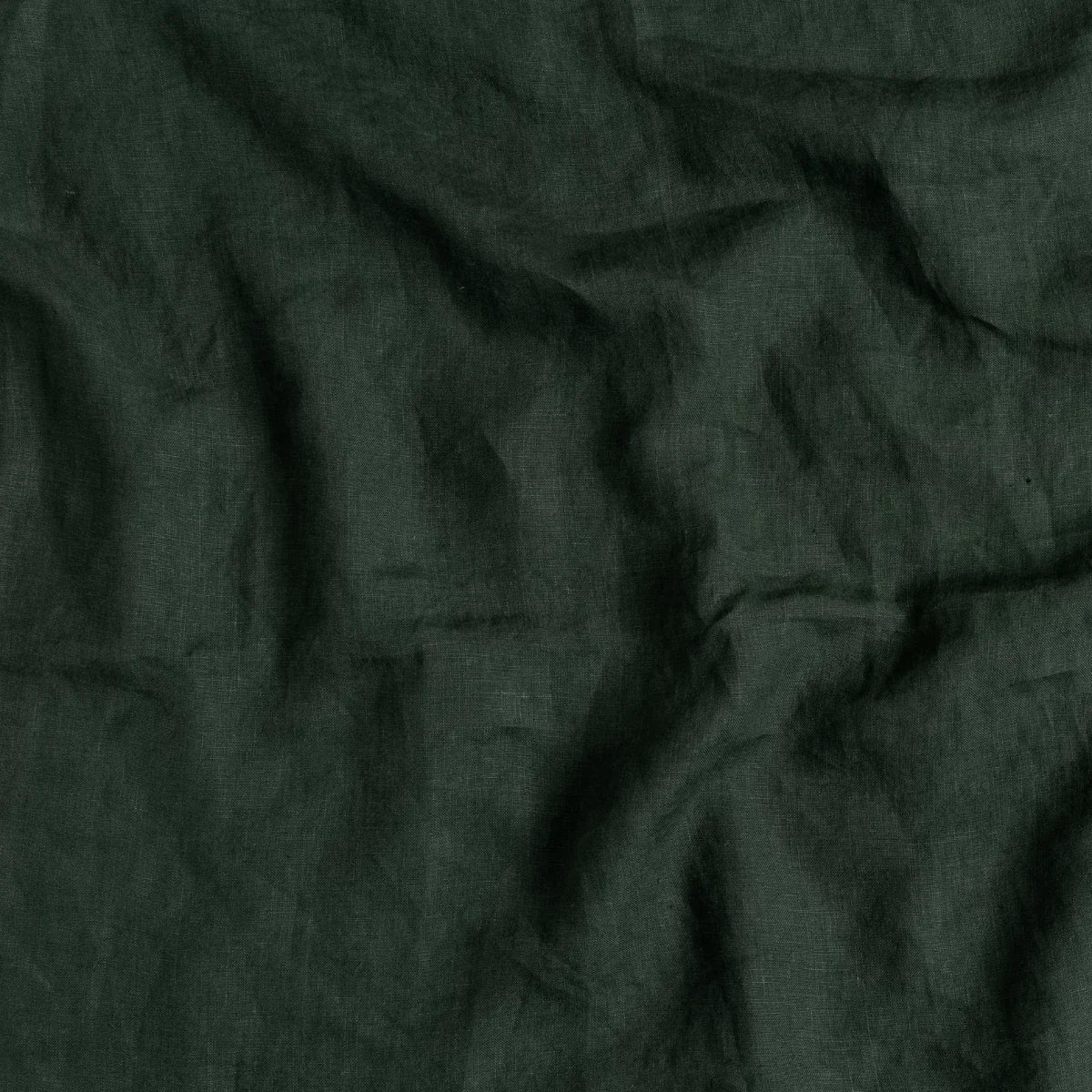 Juniper: A close up of linen in juniper, a rich green tone. 