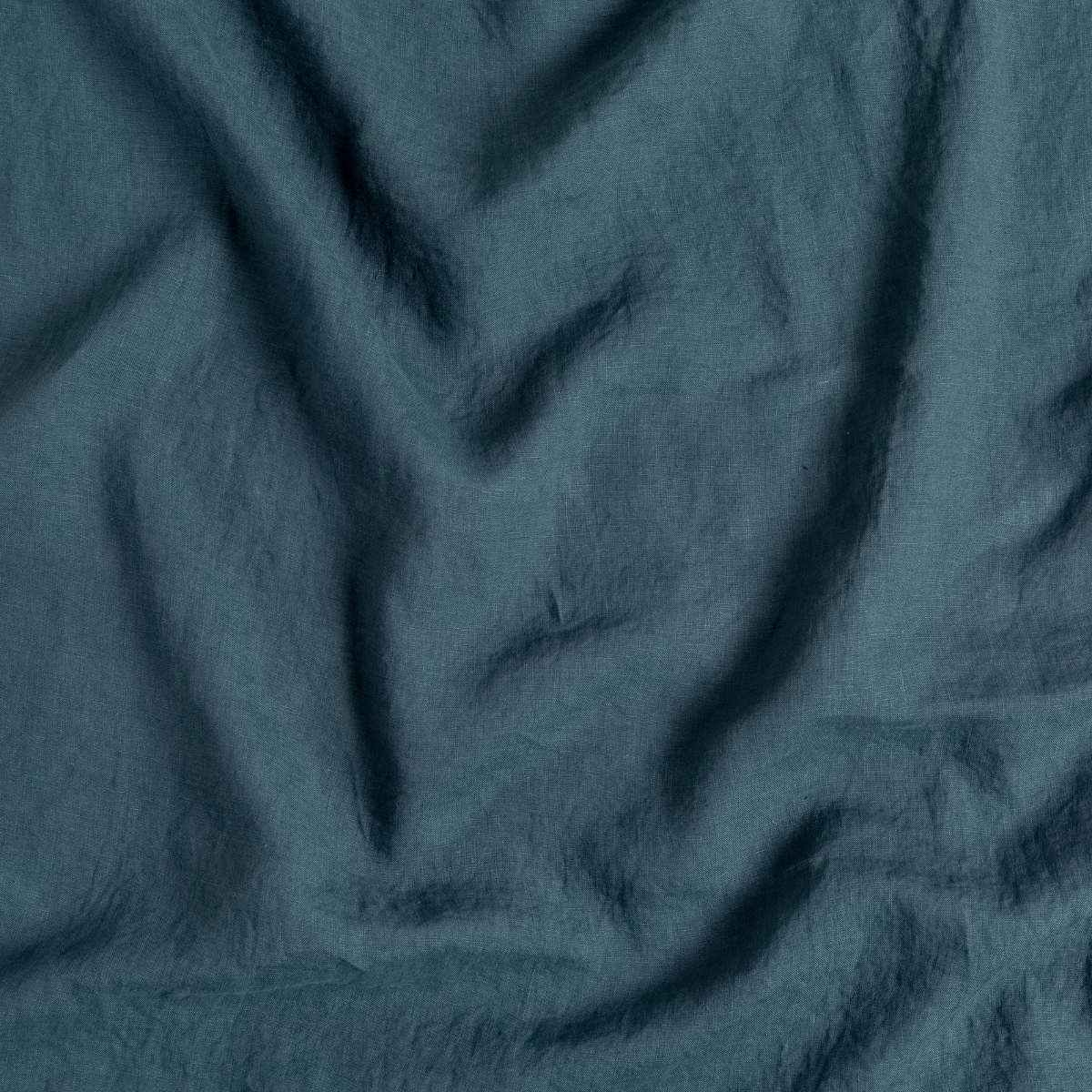 Midnight: A close up of linen fabric in midnight, a rich indigo tone.