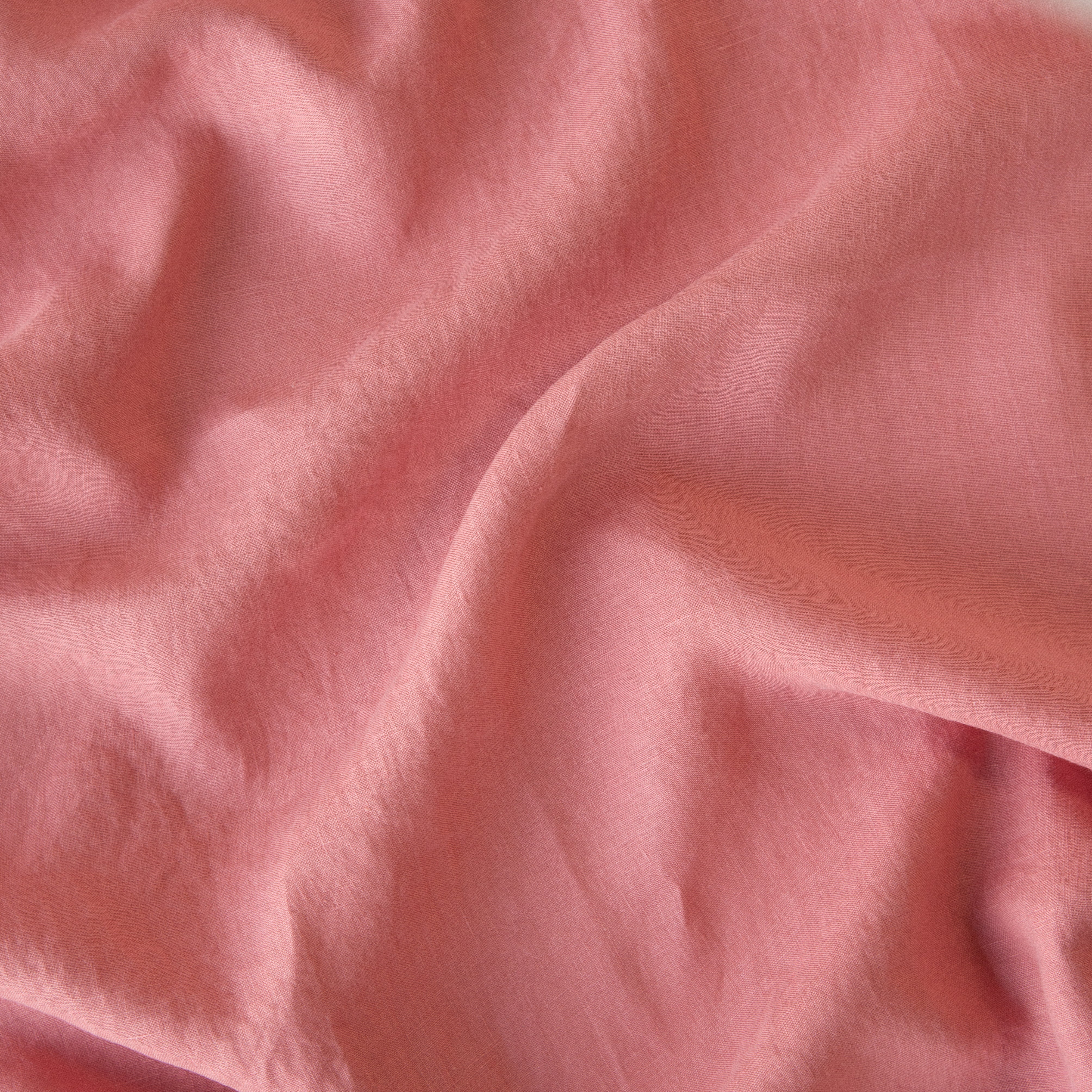 Poppy: A close up of linen in poppy, a warm coral pink.