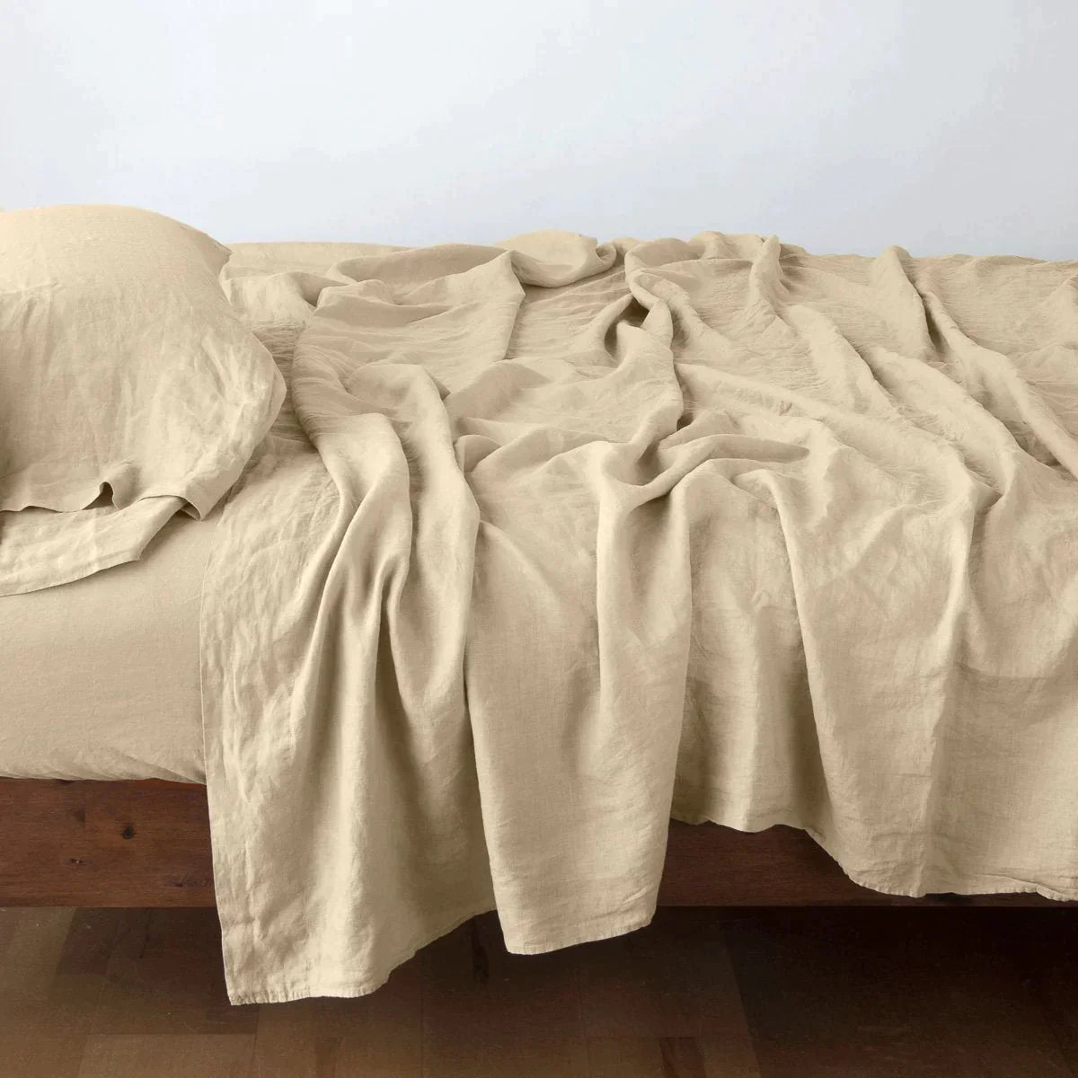 Honeycomb: Rumpled linen sheeting with matching sleeping pillow - side view.