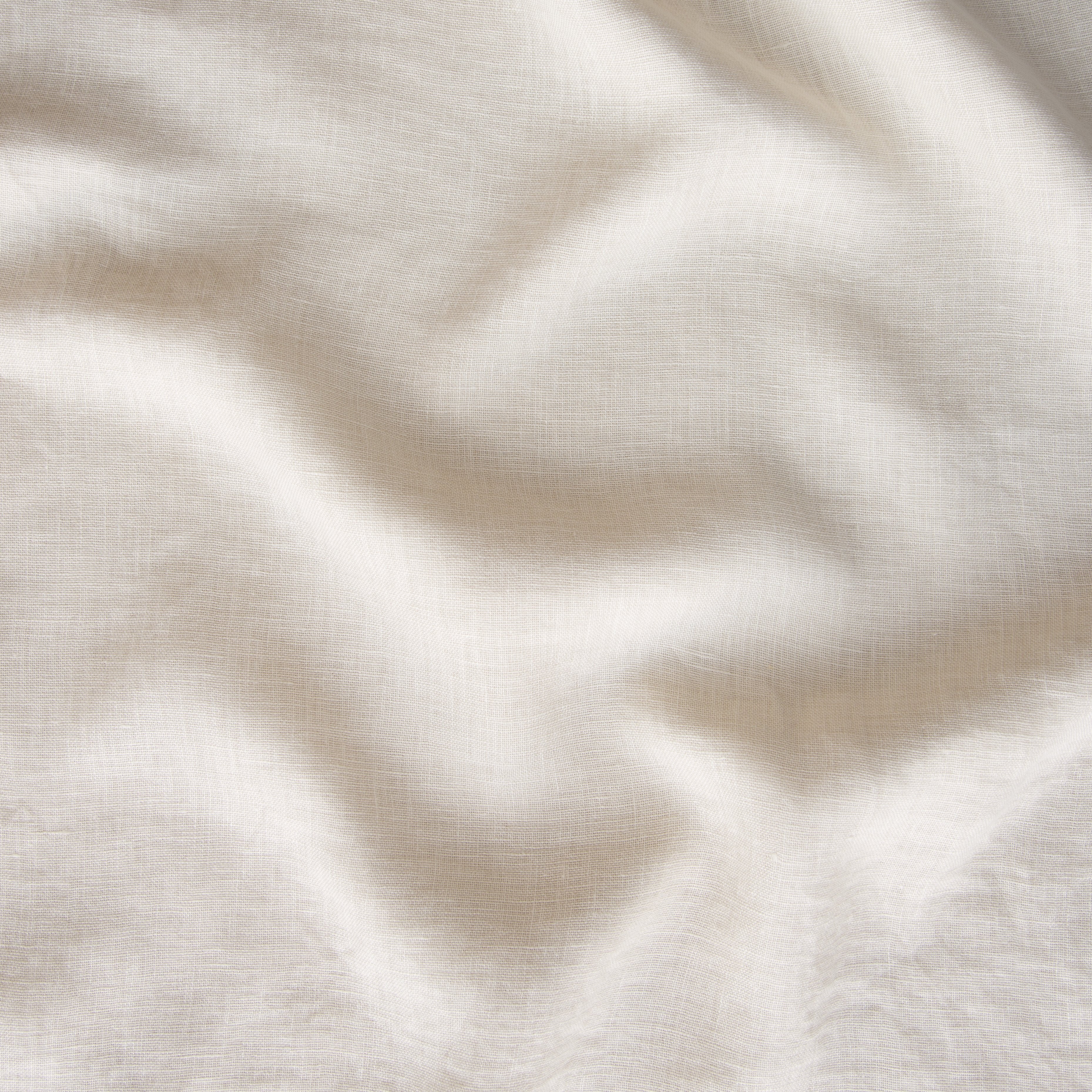 Parchment: A close up of linen whisper, our lightweight linen gauze, in parchment, a warm, antiqued cream.