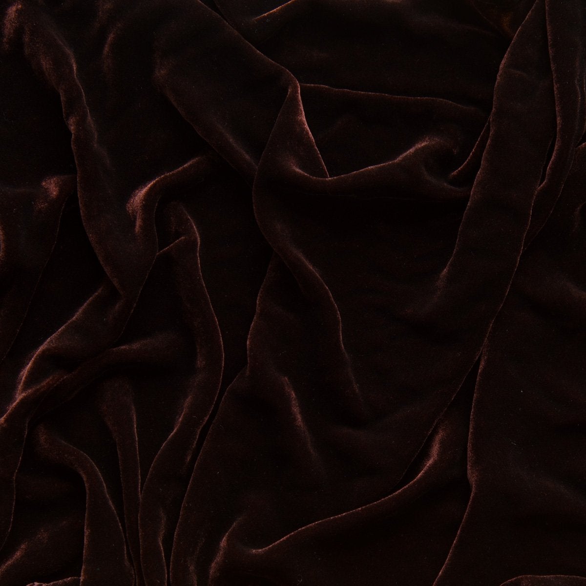 Mahogany: A close up of silk velvet in mahogany, a deep, earthen, reddish brown. 
