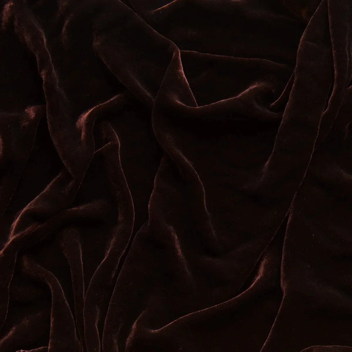 Mahogany: A close up of silk velvet in fig, a richly saturated purple-garnet. 