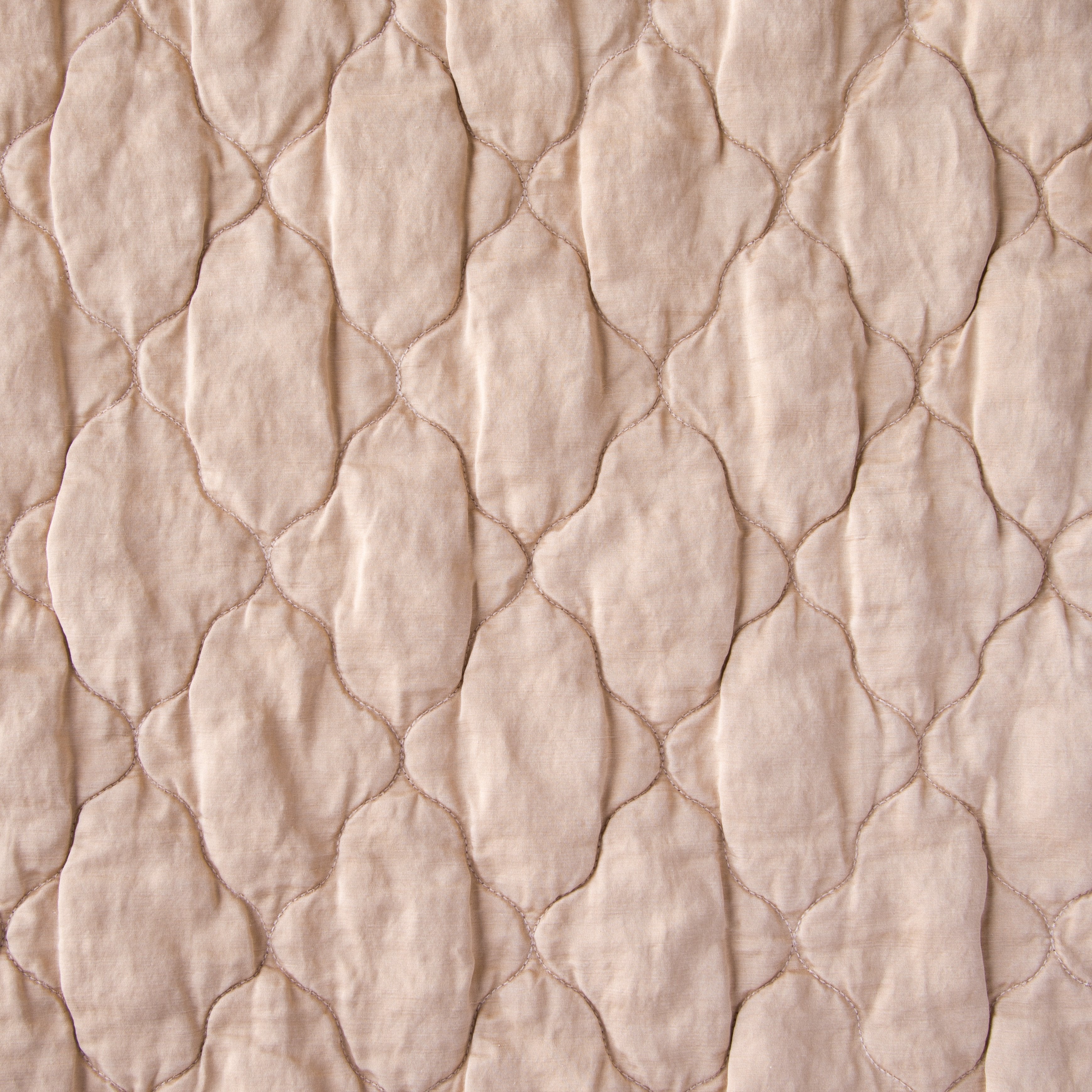 Rouge: Close-up of Luna silk charmeuse quilting in rouge, a mid-tone blush pink.