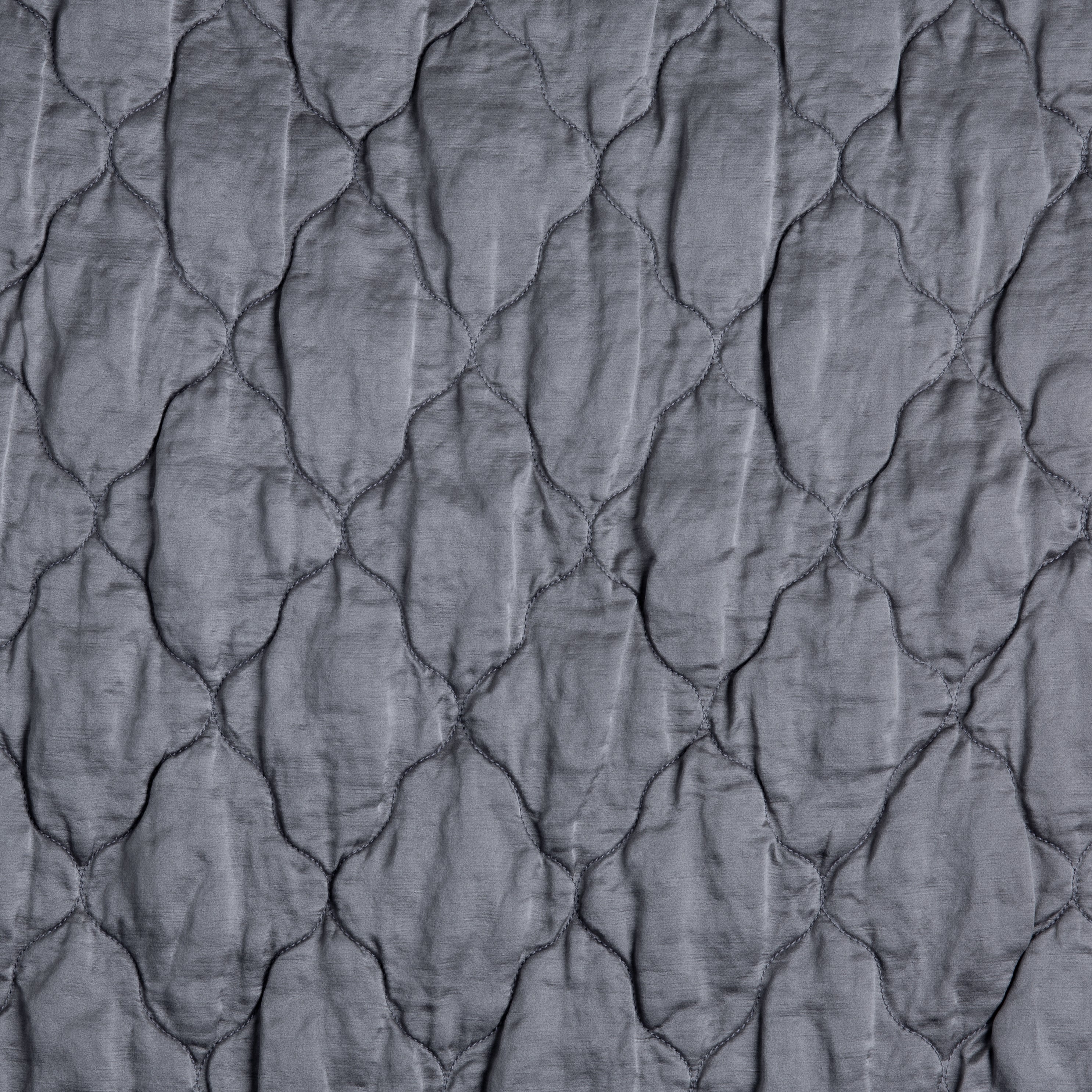 A close up of quilted charmeuse in french lavender, a neutral purple tone.