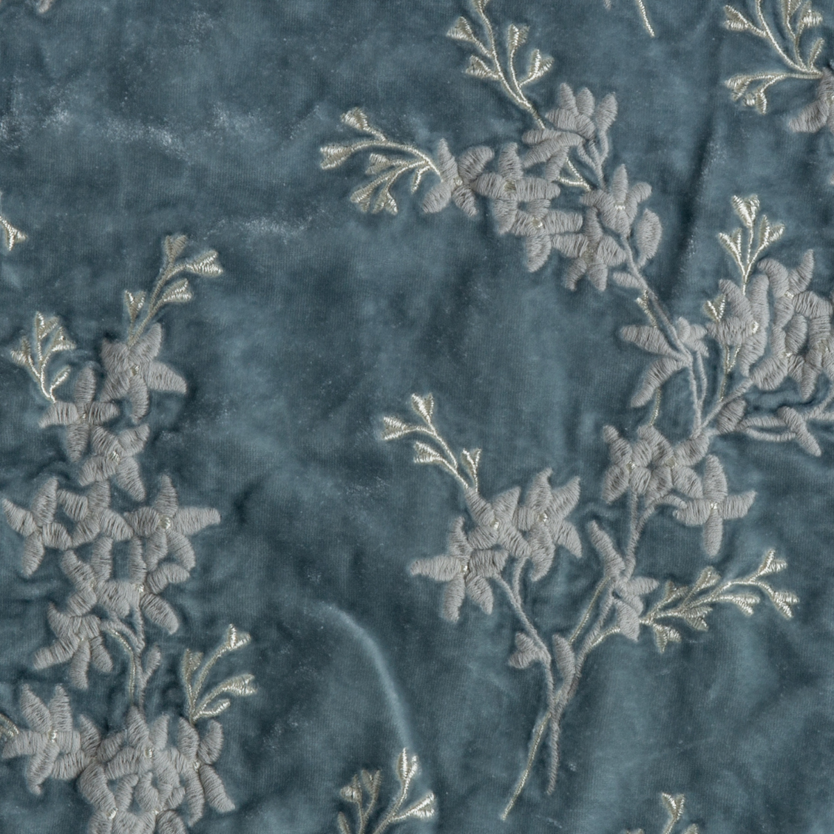 Cloud: A close up of embroidered silk velvet fabric in cloud, a soft, subtle sky blue-grey.