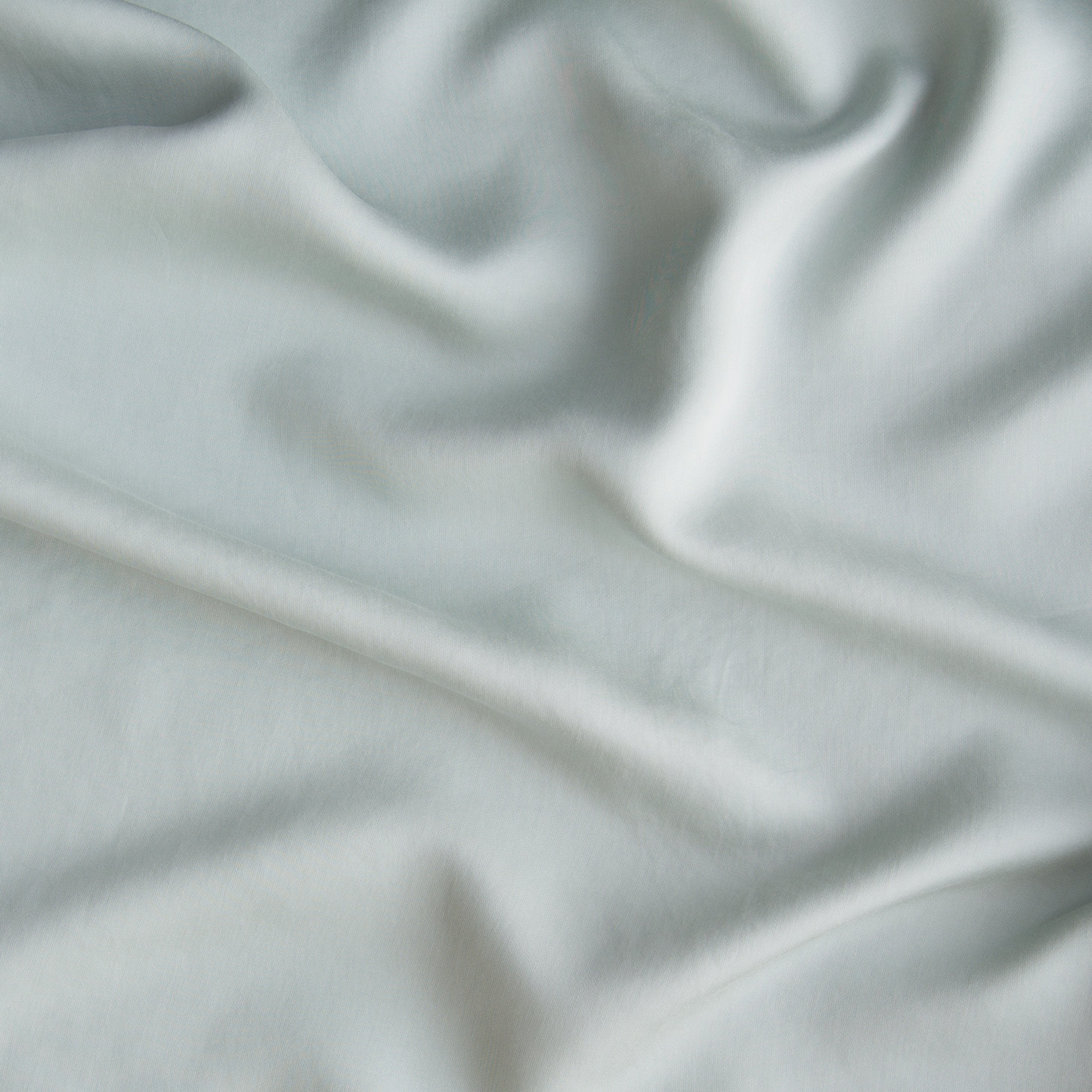 Eucalyptus: A close up of Tencel™ fabric in eucalyptus, a soft light green. 