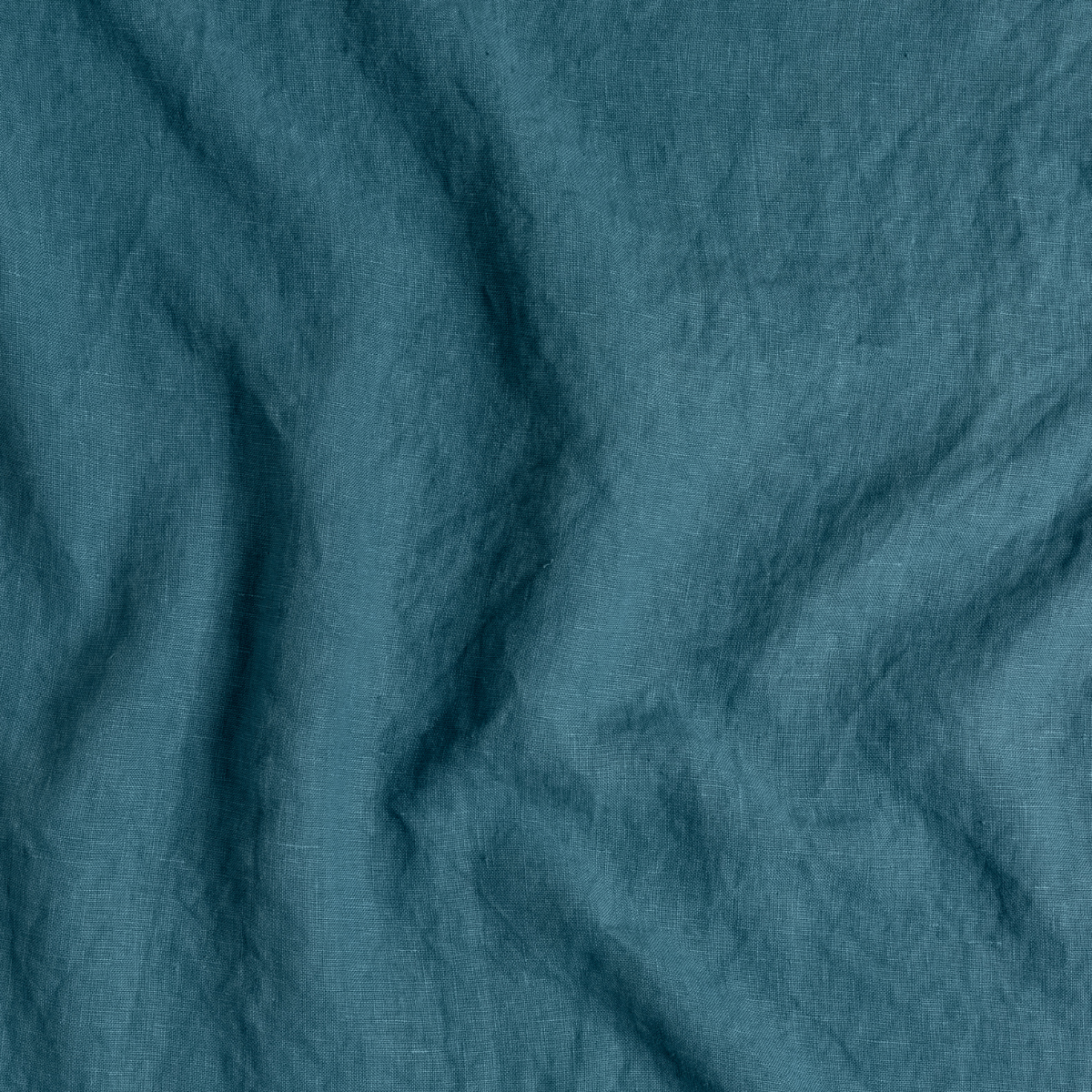 Cenote: A close up of midweight linen fabric in cenote, a vibrant, ocean-inspired blue-green.
