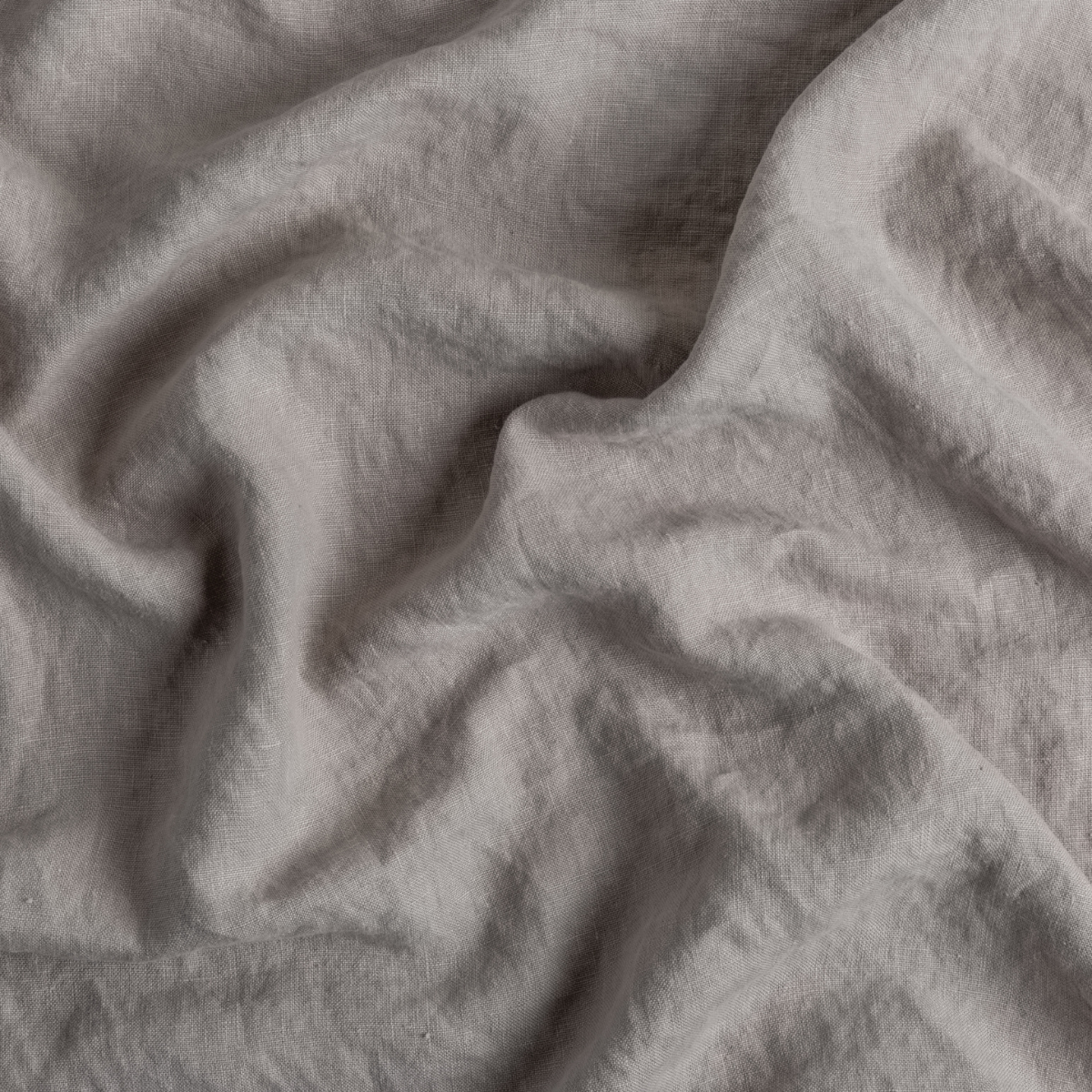 Fog: A close up of midweight linen fabric in fog, a neutral-warm, soft mid-tone grey.