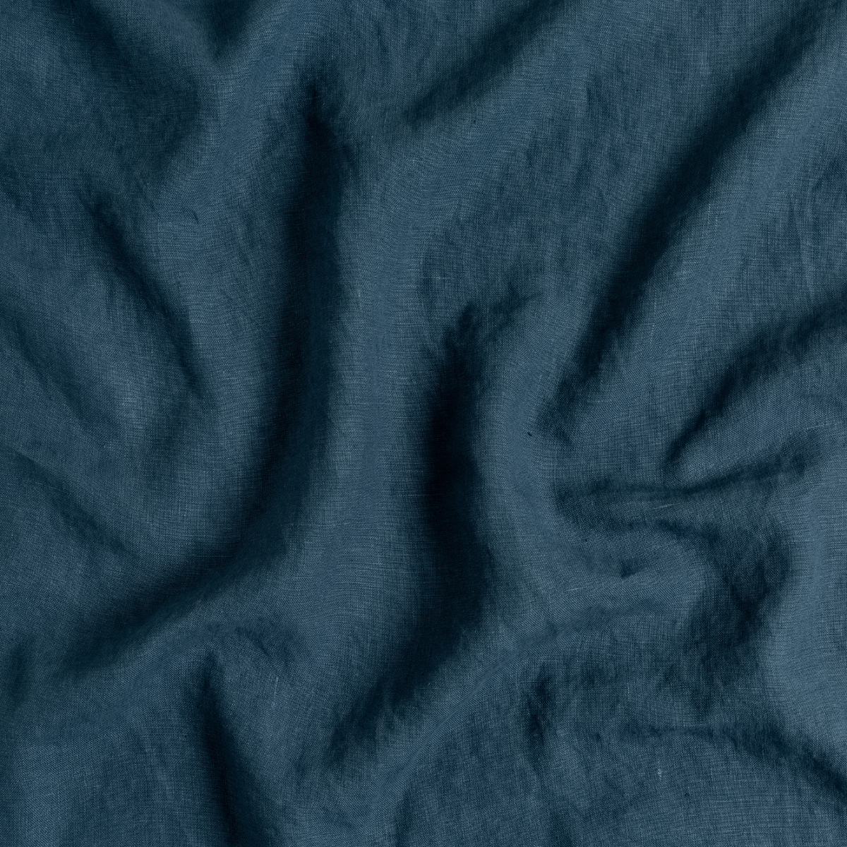 Midnight: A close up of midweight linen fabric in midnight, a rich indigo tone.