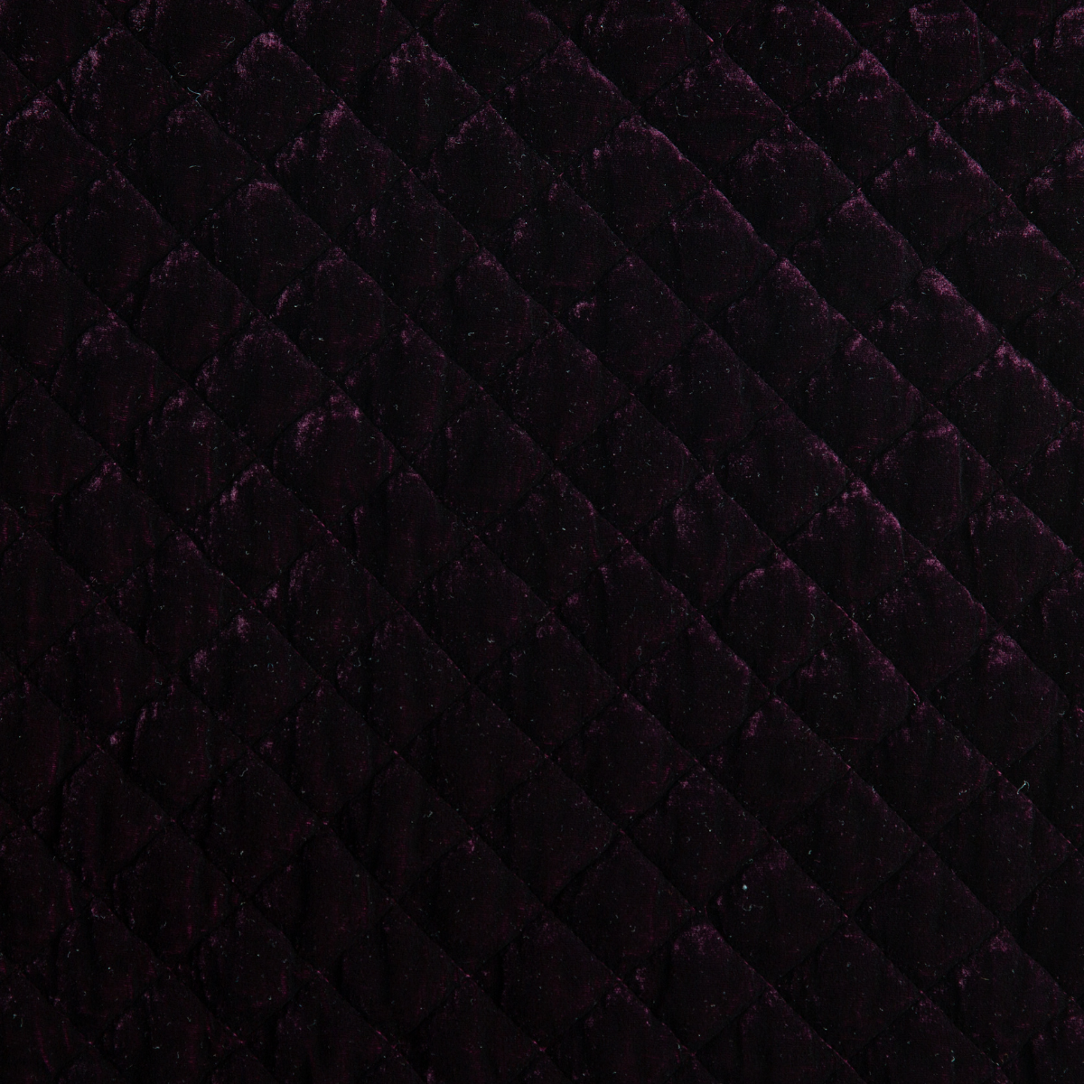 Fig: Close-up of quilted silk velvet in fig, a richly saturated purple-garnet. 