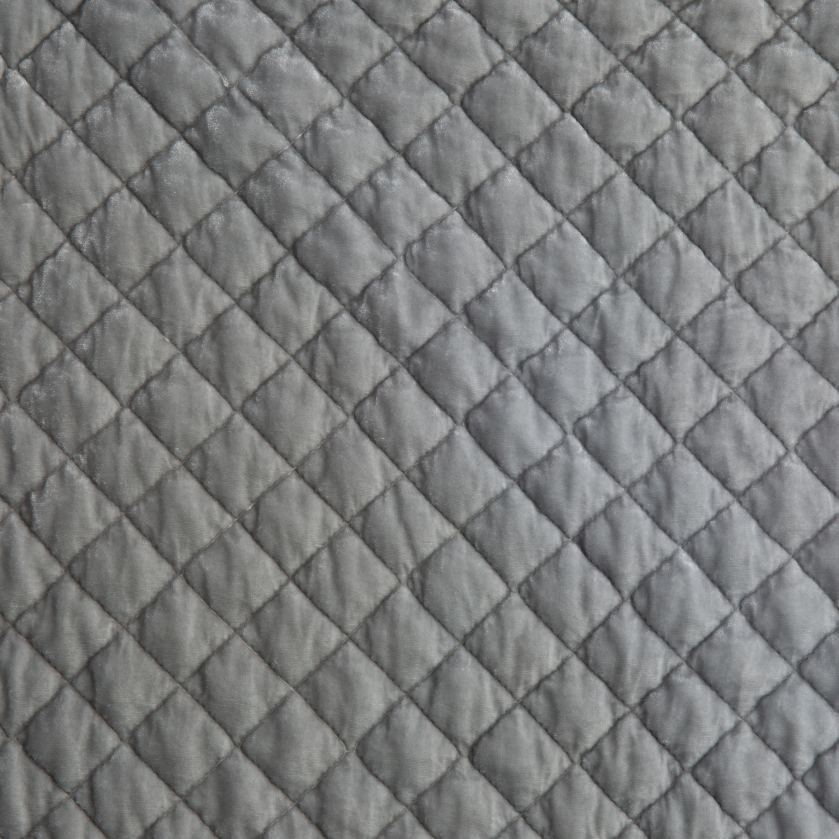 Close-up of quilted silk velvet in sterling, a silvery neutral light grey. 