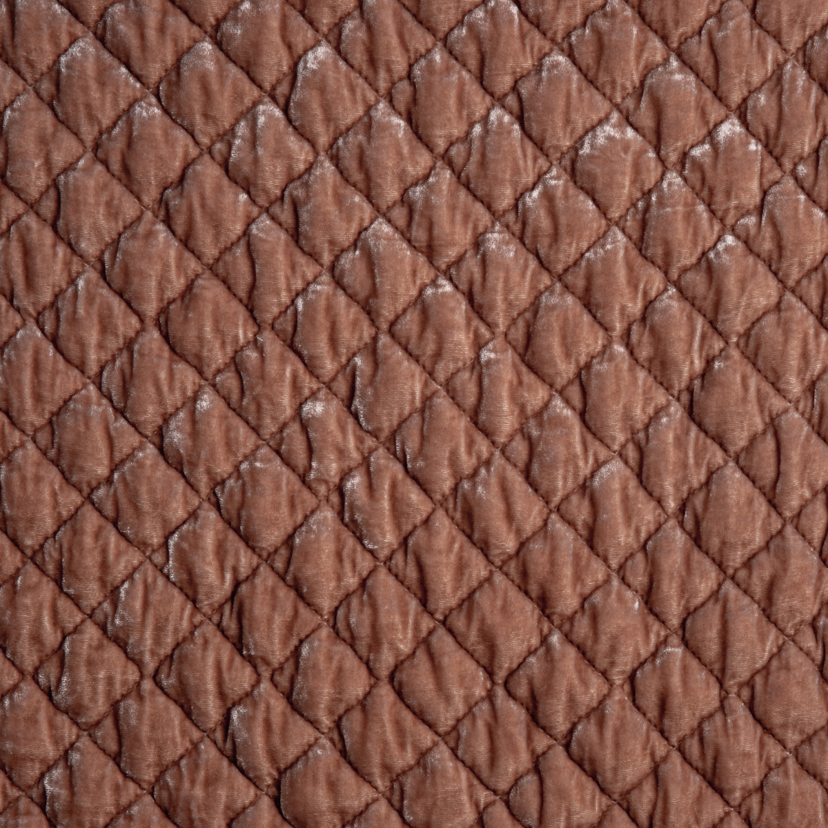 Rouge: A close up of quilted silk velvet fabric in rouge, a mid-tone blush pink.