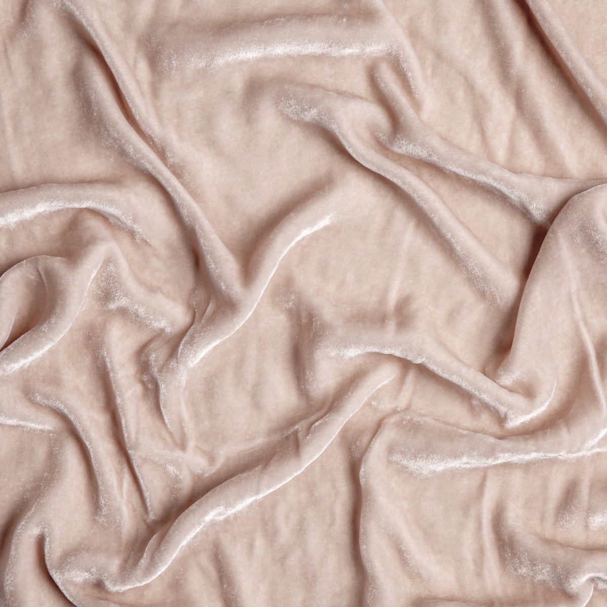 Pearl: A close up of silk velvet fabric in pearl, a nude-like, soft rose pink tone.