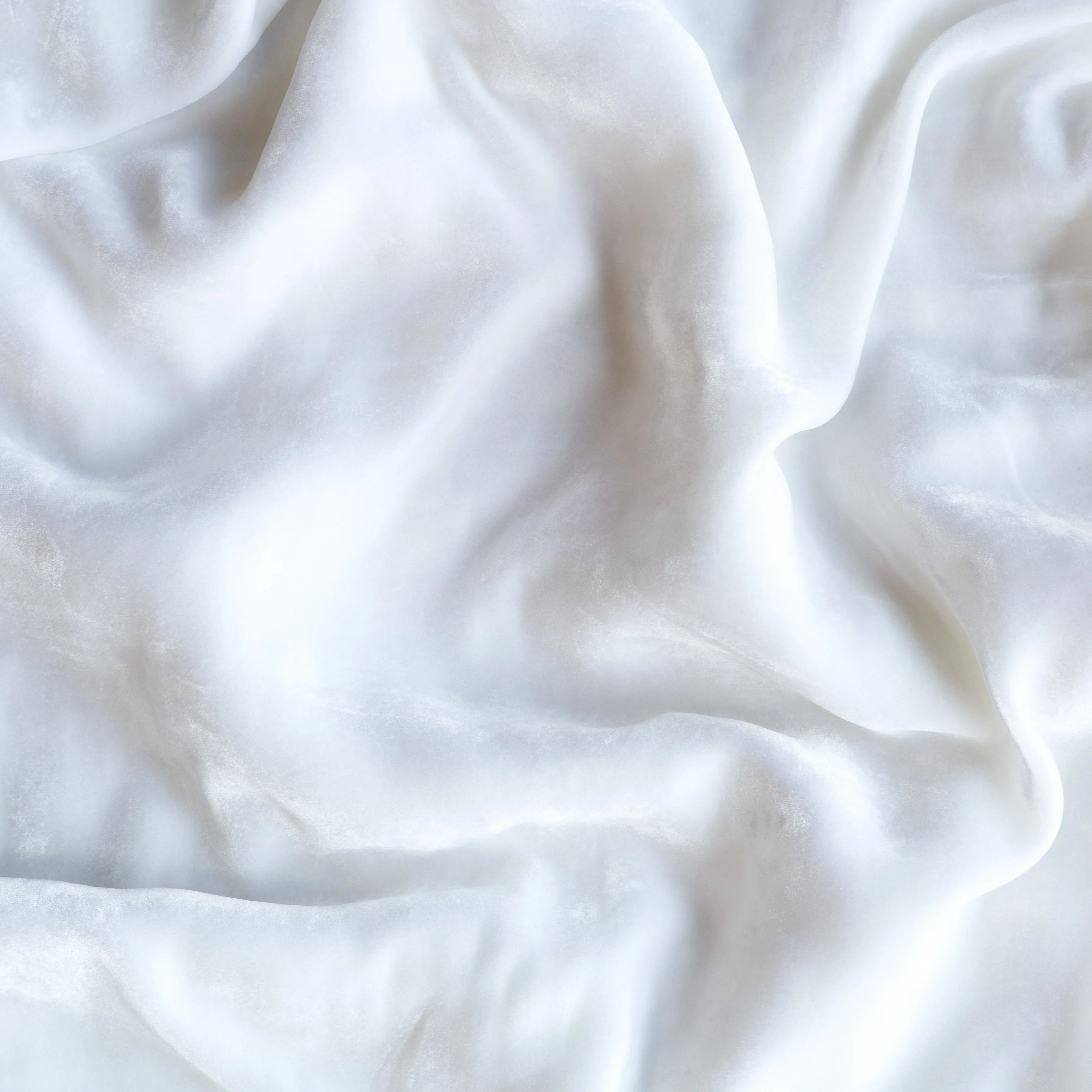 White: A close up of silk velvet in white.