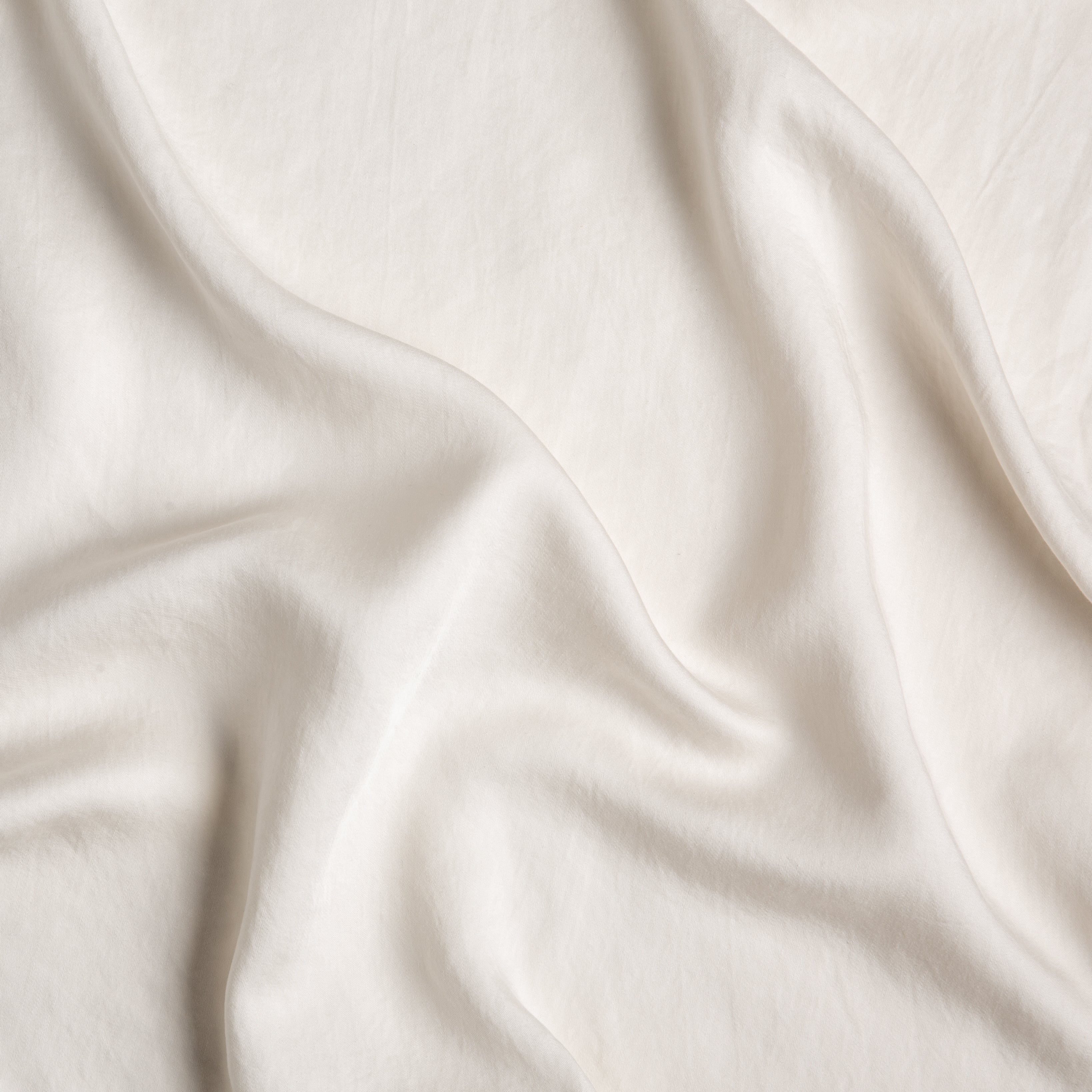 Parchment: A close up of Tencel™ fabric in parchment, a warm, antiqued cream.