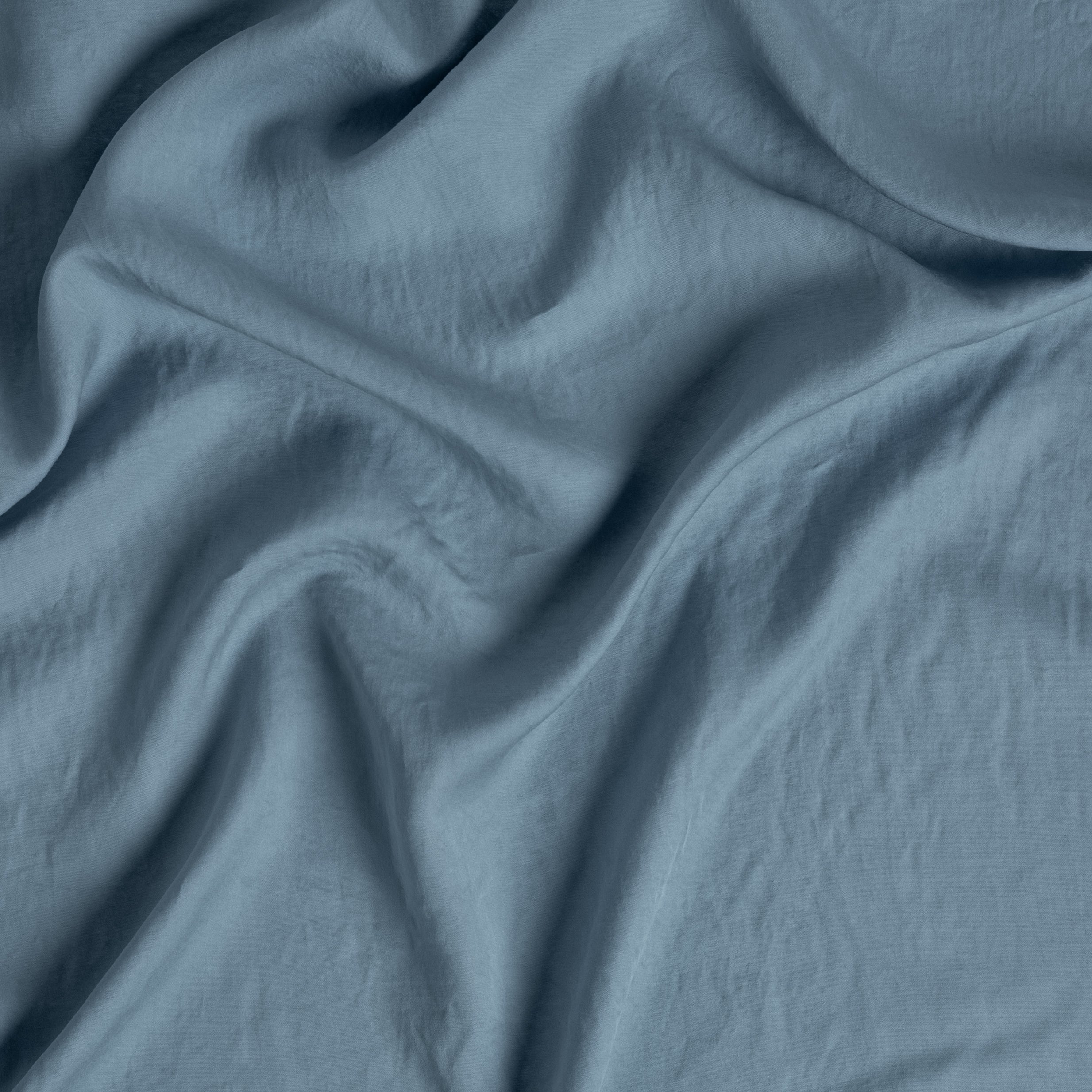 Tahoe Blue: a close up of tencel™ fabric gently rumpled. 